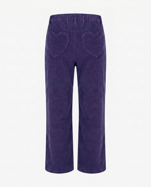 Purple corduroy pants with heart shapes on a white background