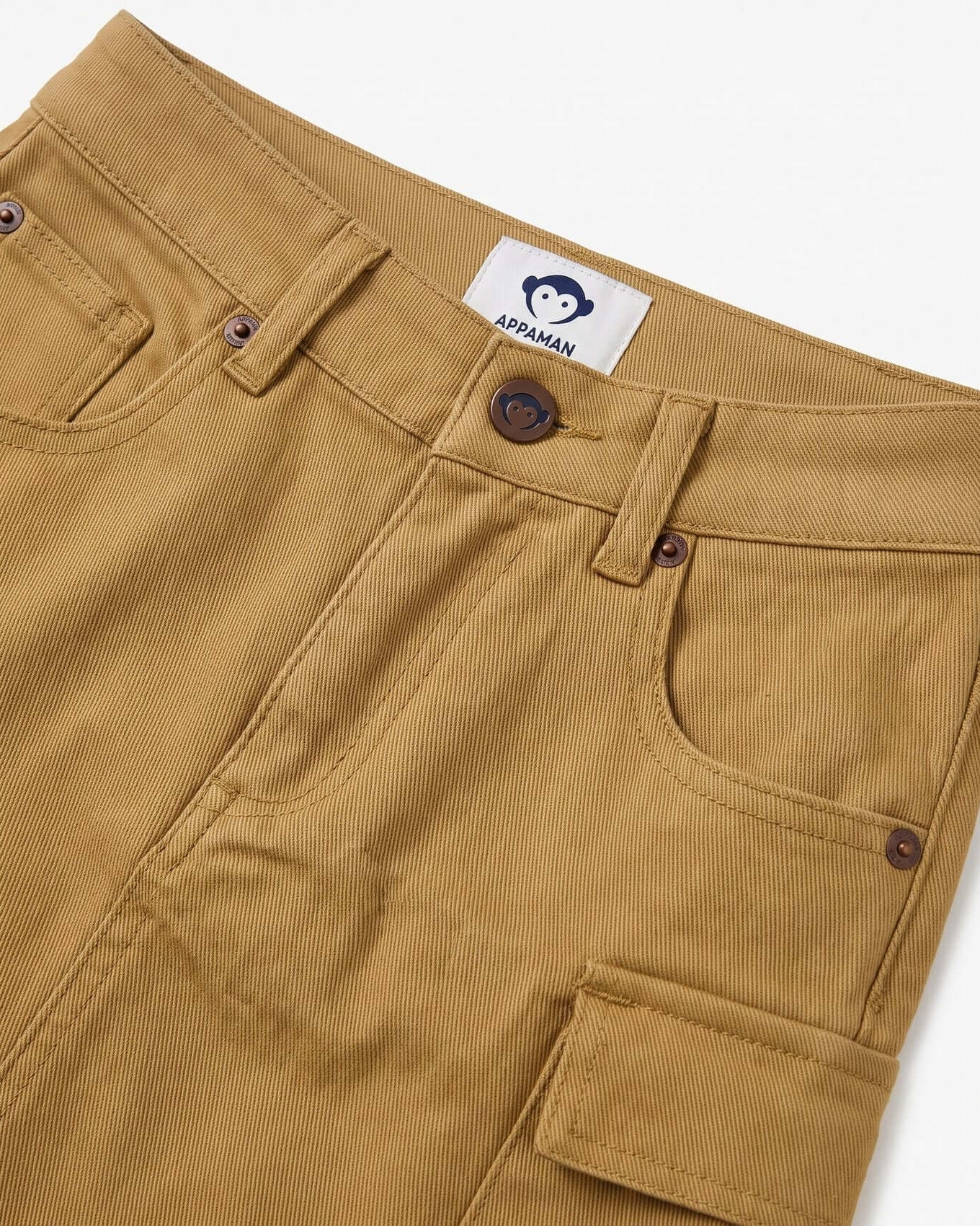 Close-up of brown chipmunk skirt with a brand label on a white background