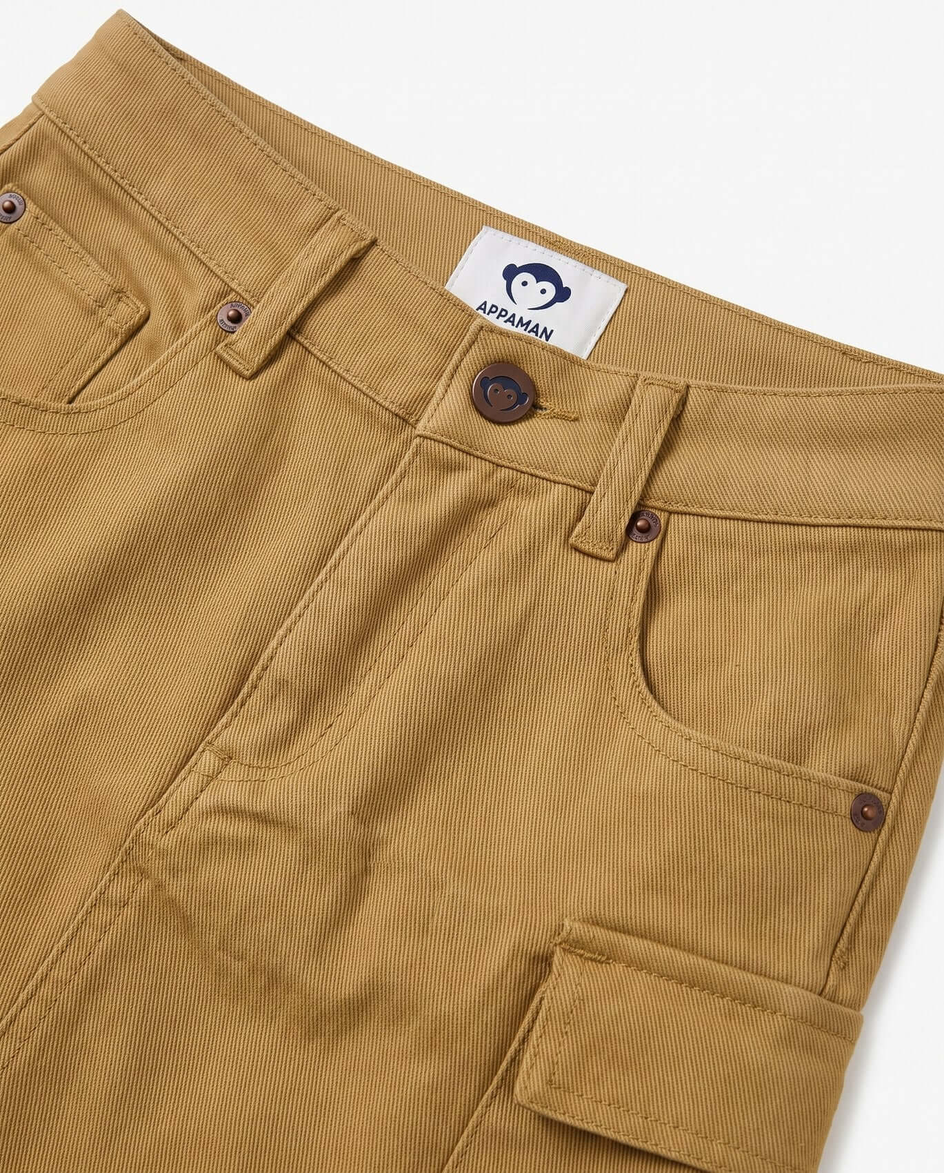 Close-up of brown chipmunk skirt with a brand label on a white background