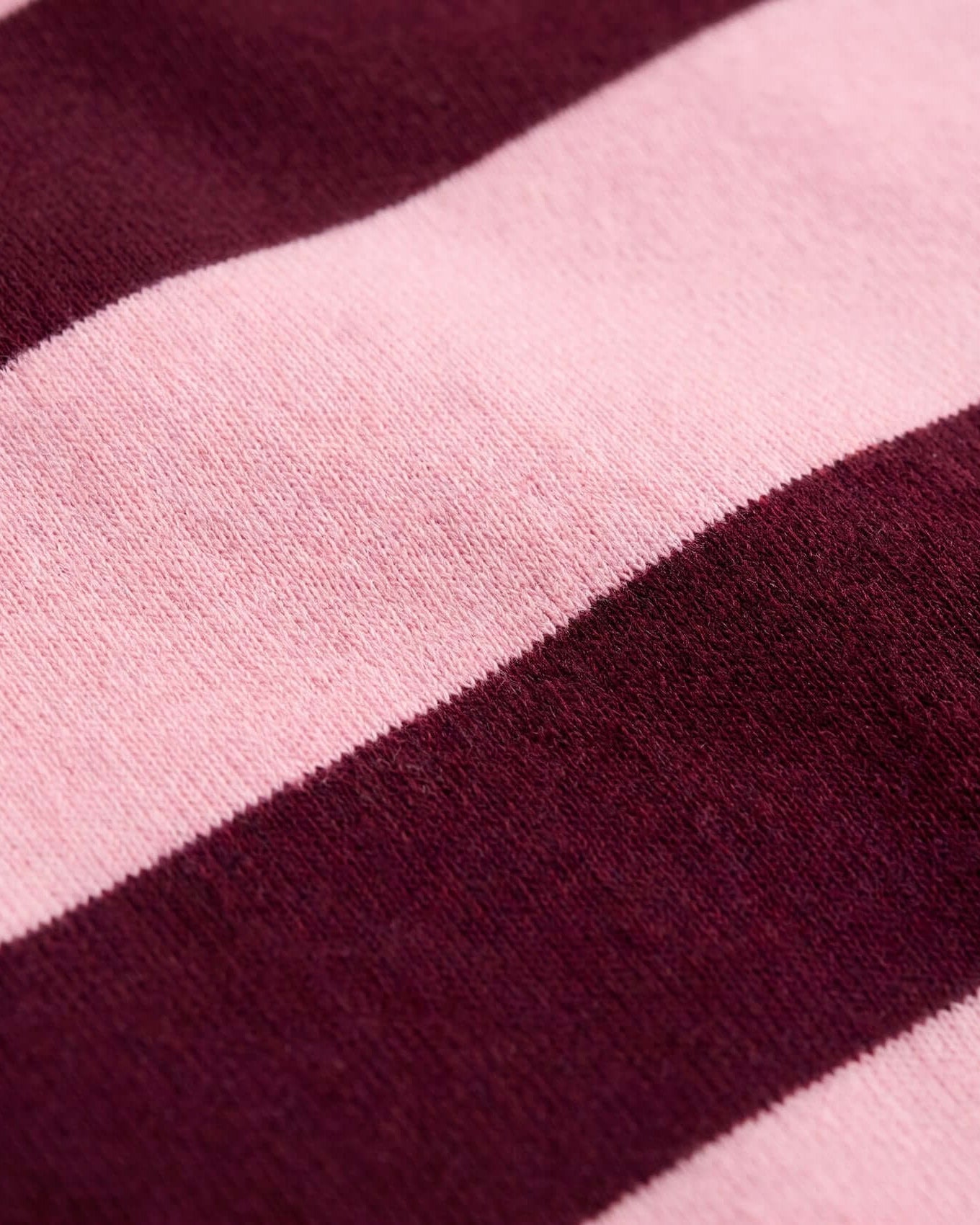 Close-up of a pink and purple striped fabric texture