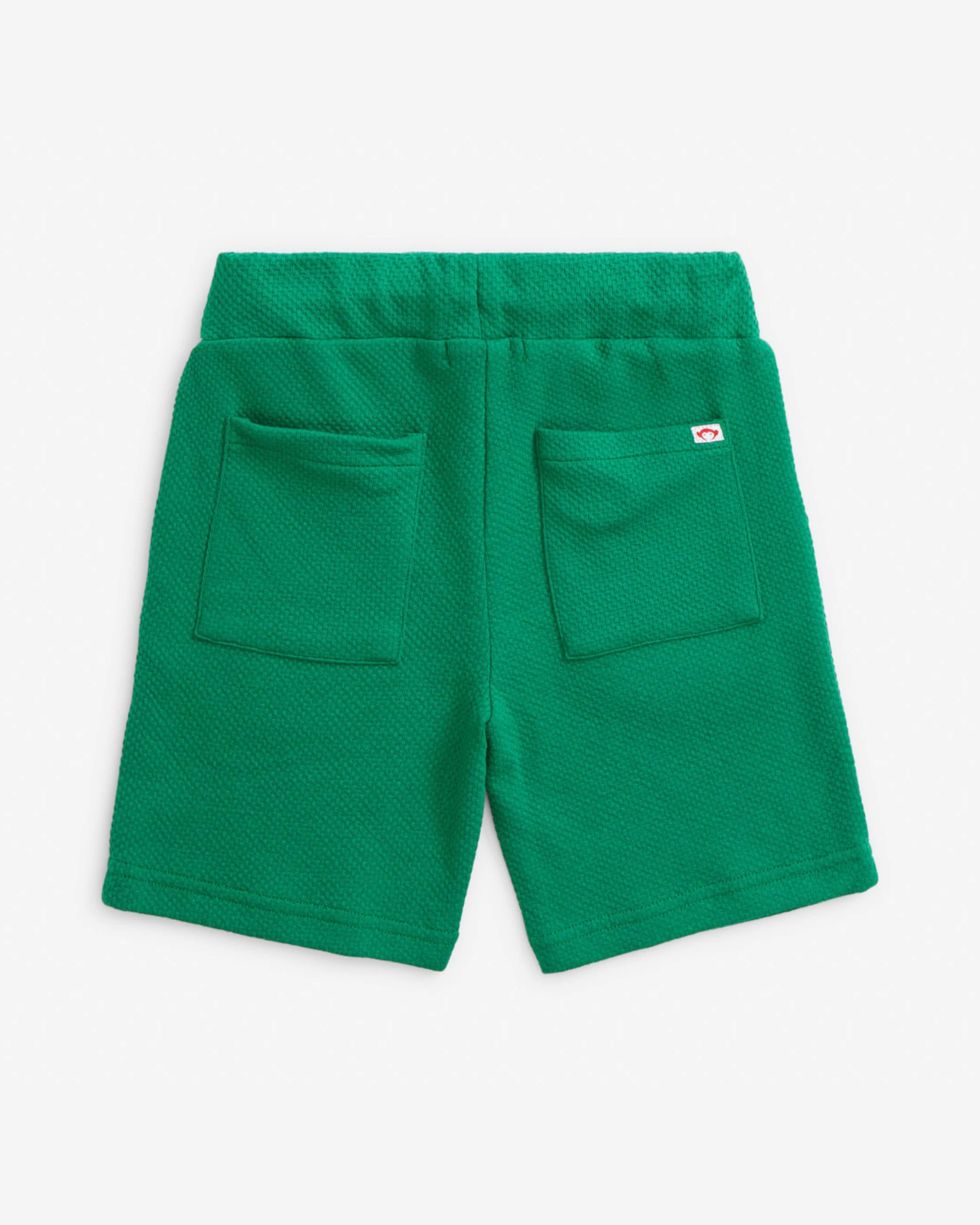 Back view of the Garden Green Resort Short showcasing pockets and comfortable pull-on design.