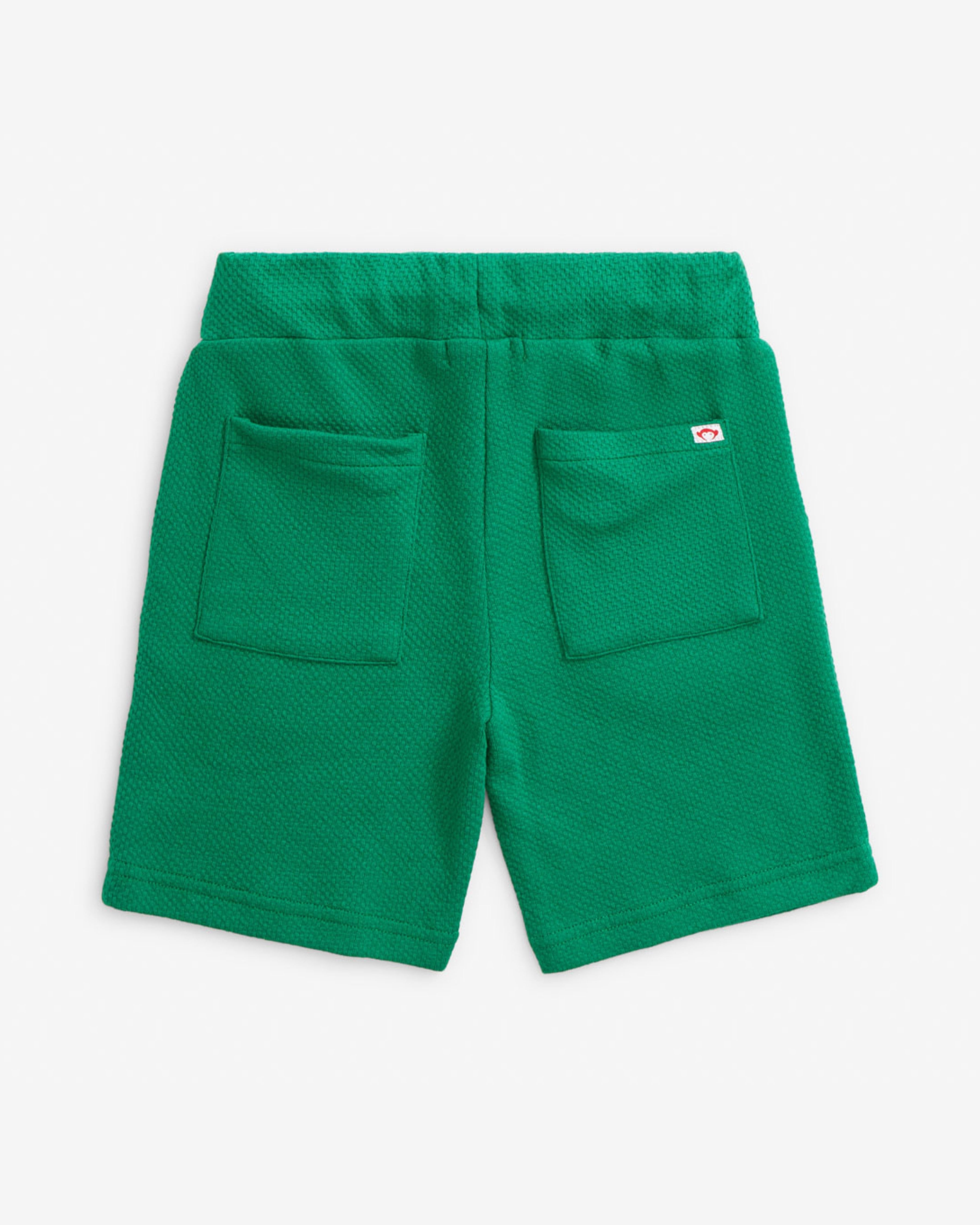 Back view of the Garden Green Resort Short showcasing pockets and comfortable pull-on design.
