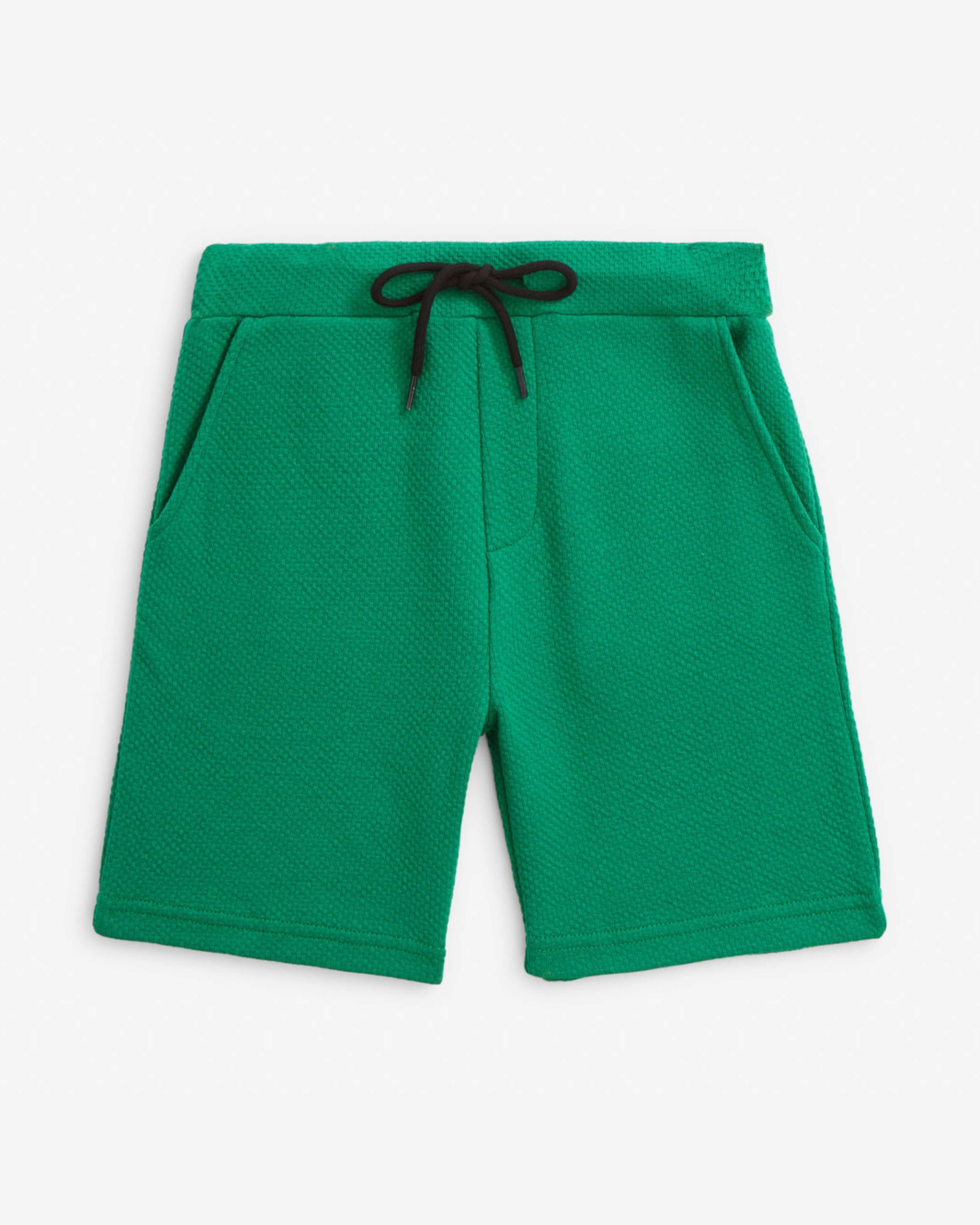 Garden Green Resort Short in bright green color, featuring a drawstring and pockets for comfort and practicality.