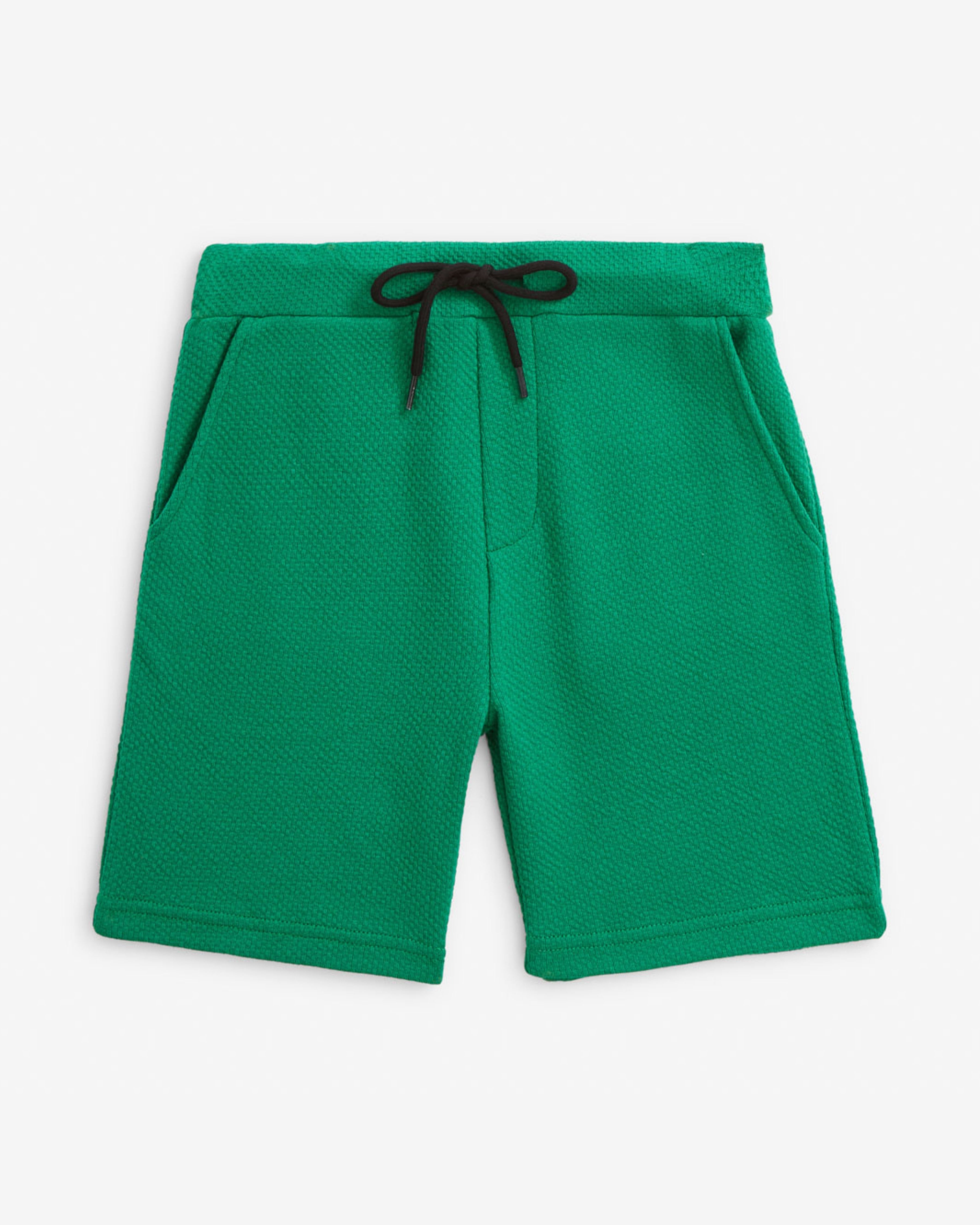 Garden Green Resort Short in bright green color, featuring a drawstring and pockets for comfort and practicality.