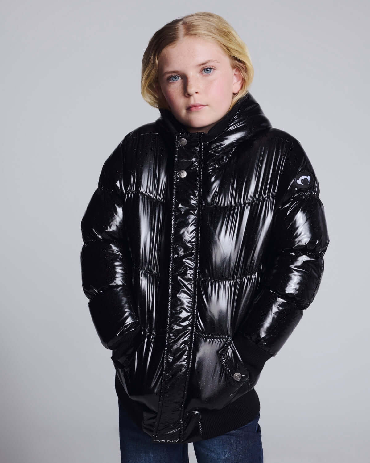Black Glitter Puffy Coat worn by a child; stylish, warm, and perfect for chilly weather.