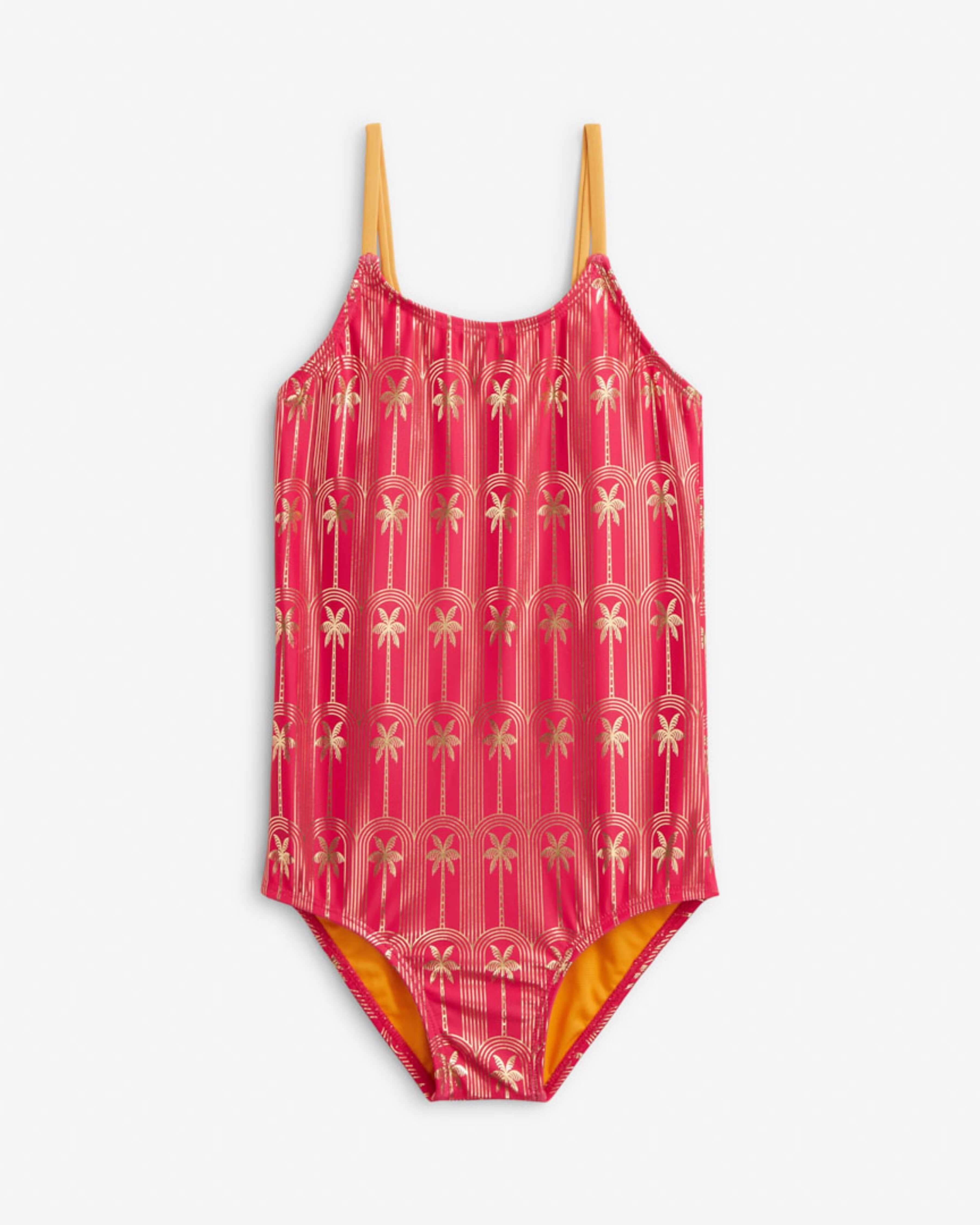 Gold Palms Taylor Swimsuit featuring a pink palm tree print, scoop neckline, and spaghetti straps, perfect for sunny days.