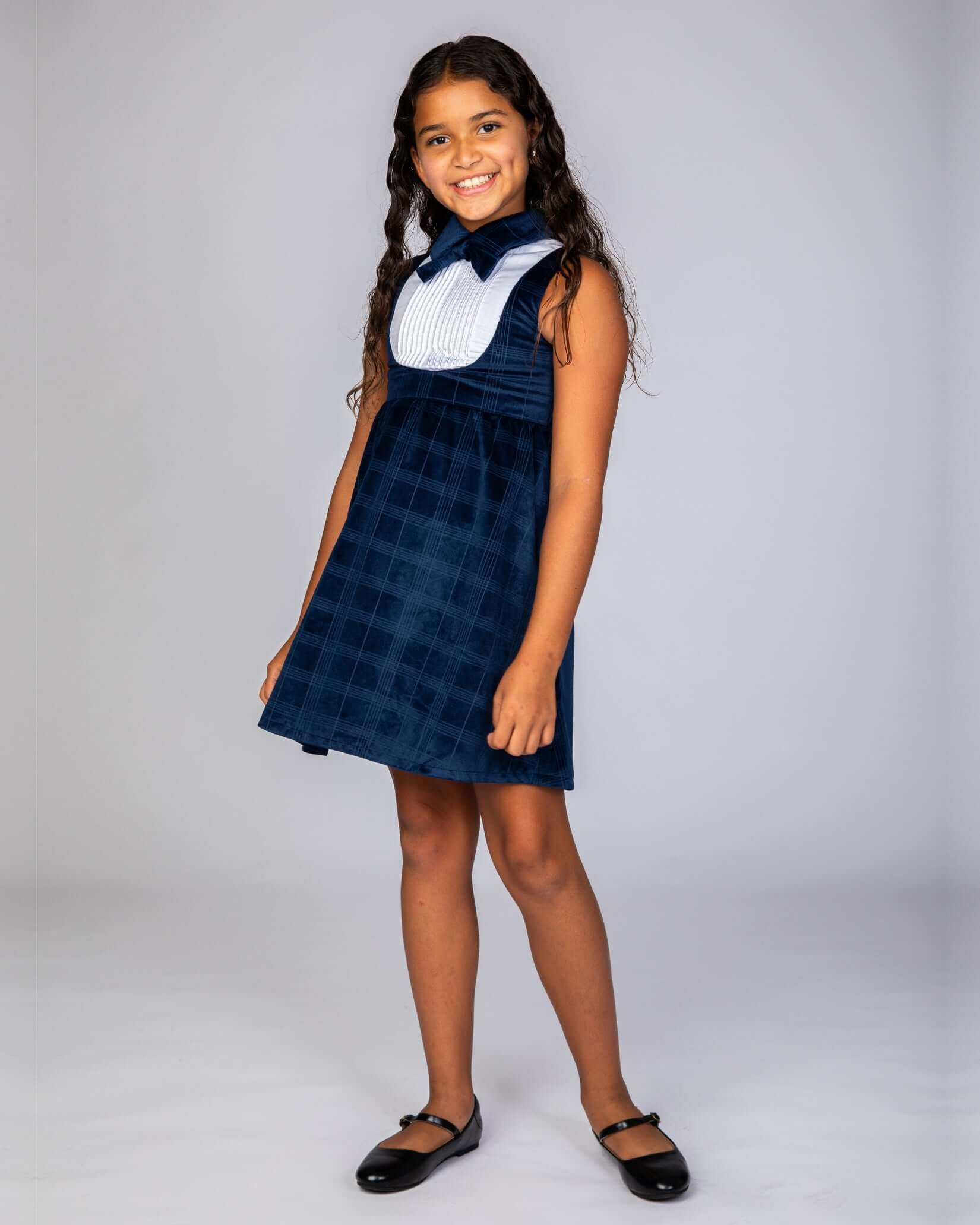 Blue Velvet Windows Tuxedo Dress on a girl with long hair, featuring a blue velvet pattern and tuxedo-inspired collar.