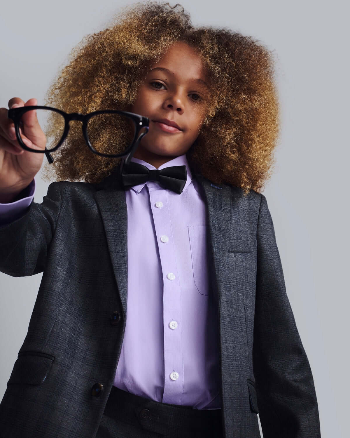 Lavender Purple Standard Button Down shirt styled with a suit and bow tie, worn by a boy holding glasses.