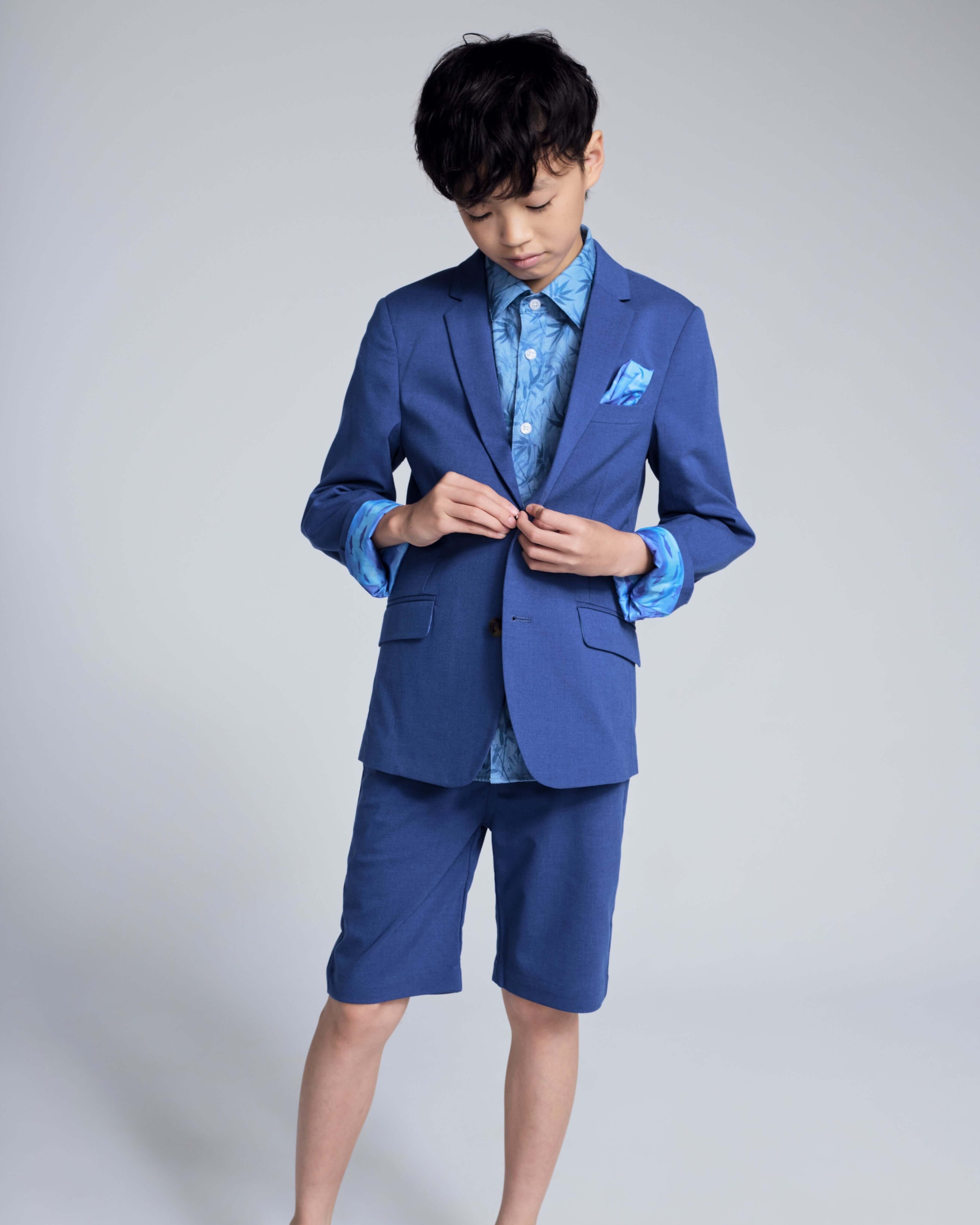 Boy wearing a Linen Canopy Blue Sports Jacket with shorts, showcasing stylish warm-weather fashion.