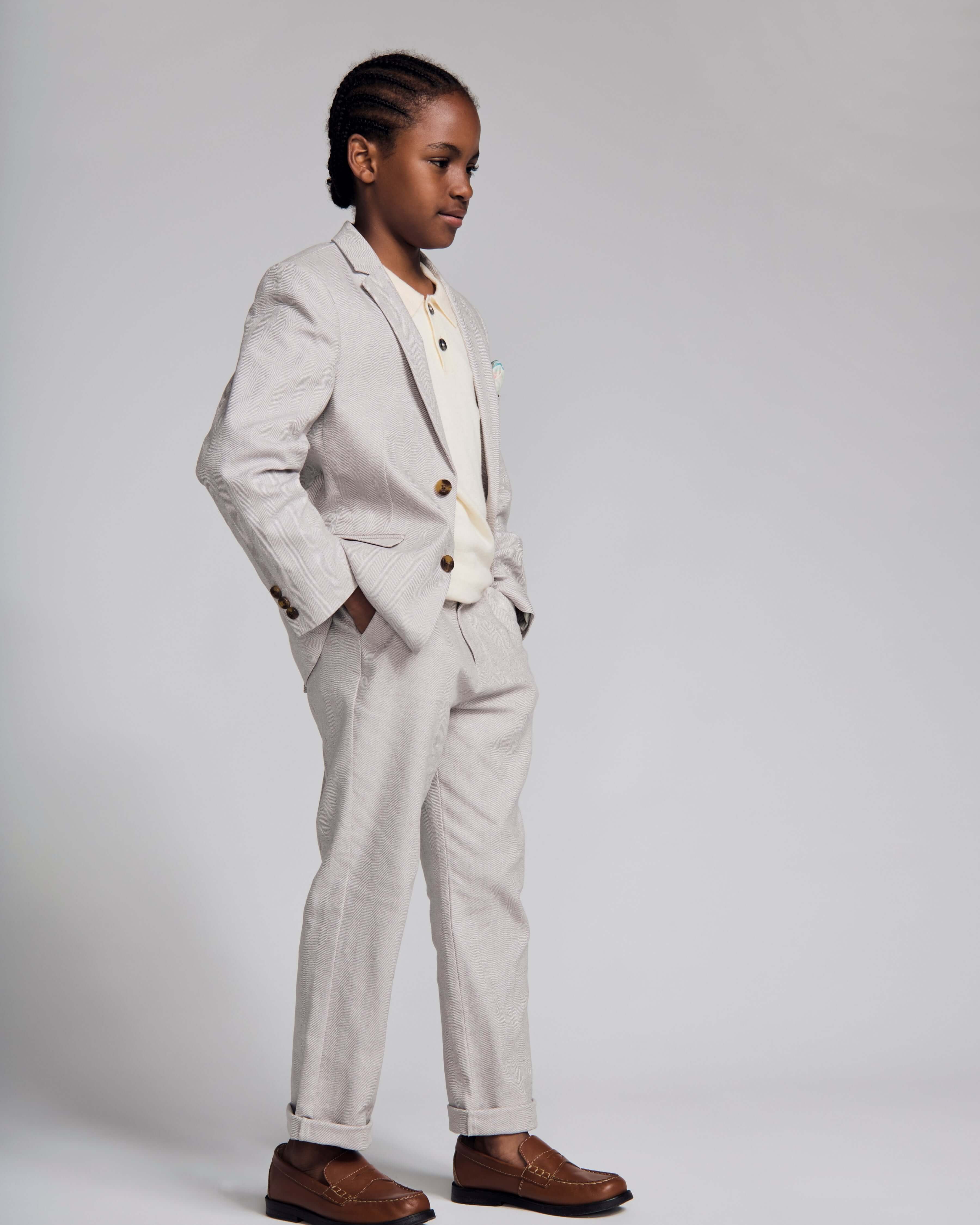 Stylish boy wearing a Linen Grey Beach Pant and sports jacket, perfect for summer events and polished outfits.