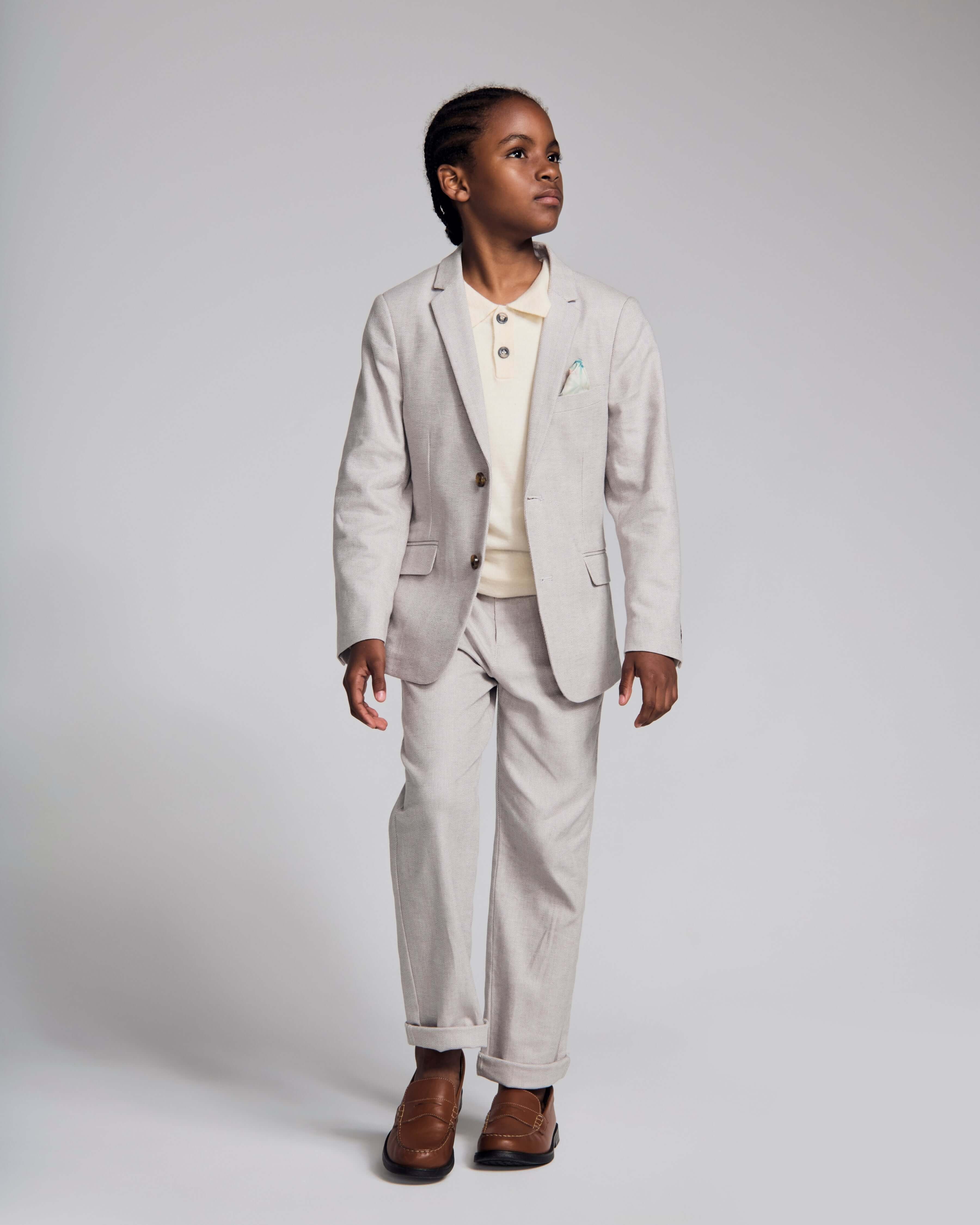 A boy wearing the Linen Grey Beach Pant with a matching Linen Grey Sports Jacket, stylish outfit for warm weather.