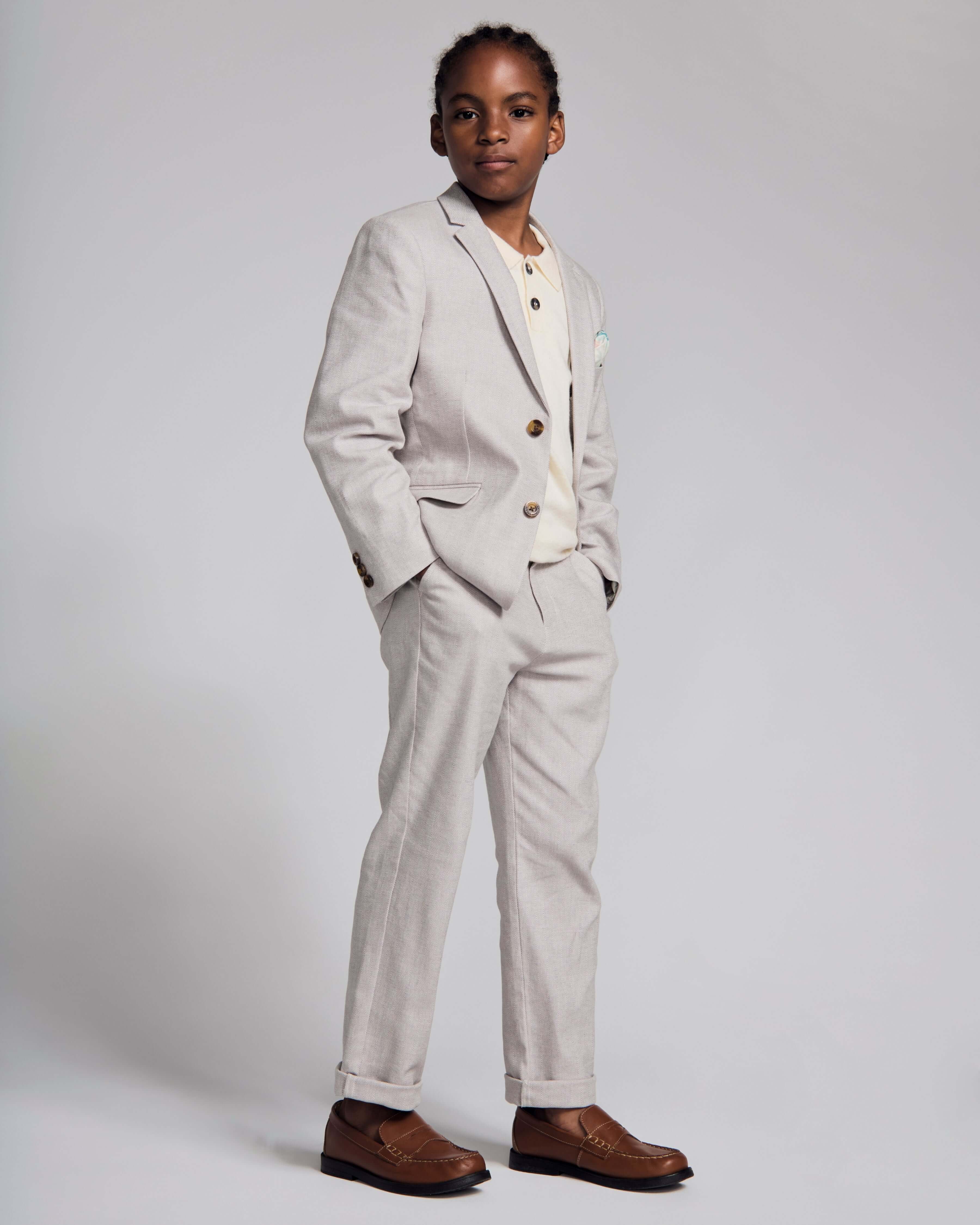 Linen Grey Beach Pant paired with a stylish sports jacket for a polished summer outfit.