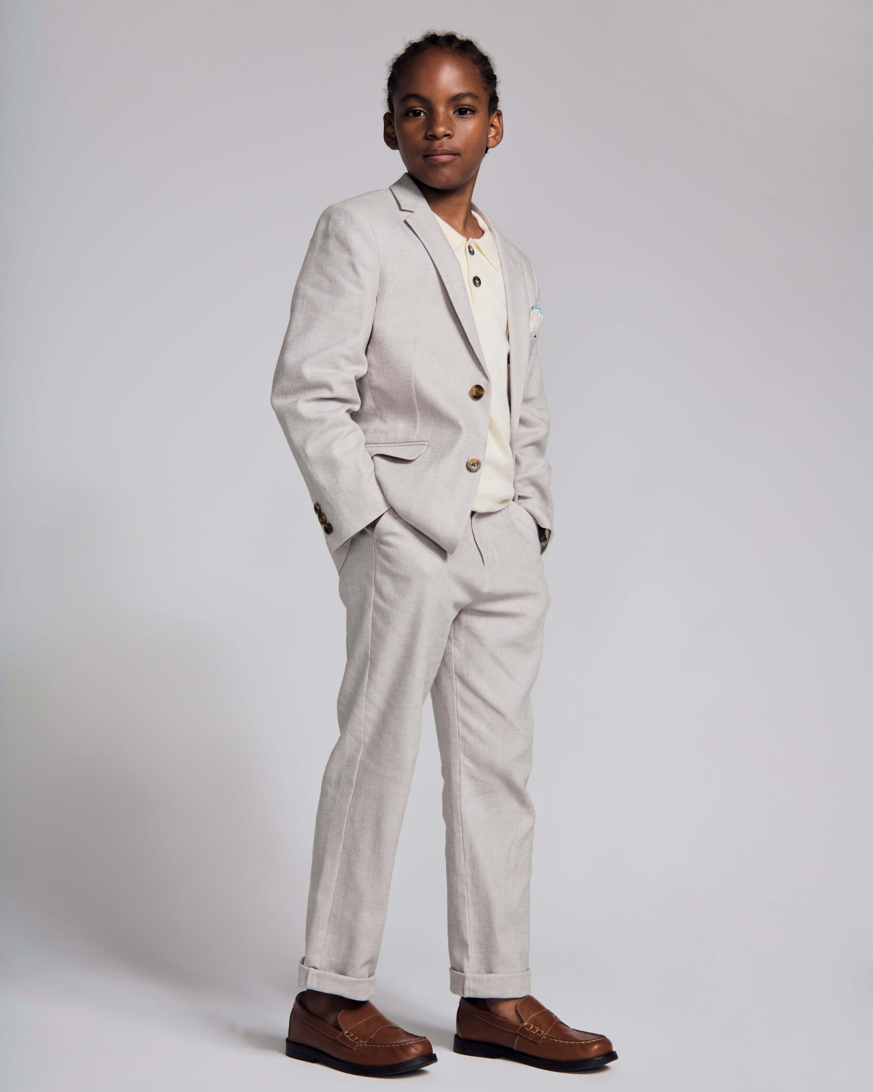 Linen Warm Grey Sports Jacket worn by a boy, showcasing timeless style and comfort in a formal setting.