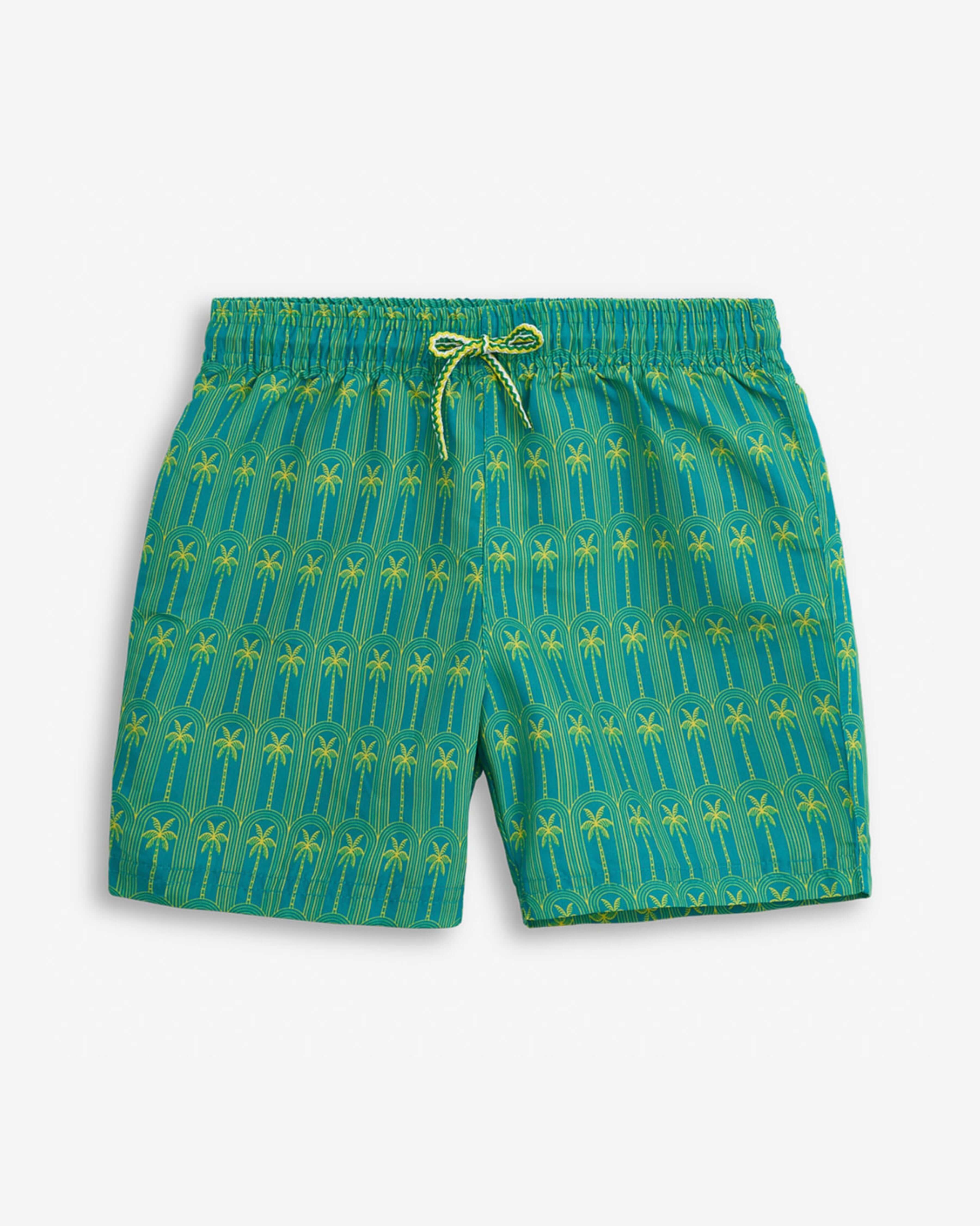 Luxury Palms Swim Set: vibrant green swim shorts with palm tree pattern for high quality kids' clothing.