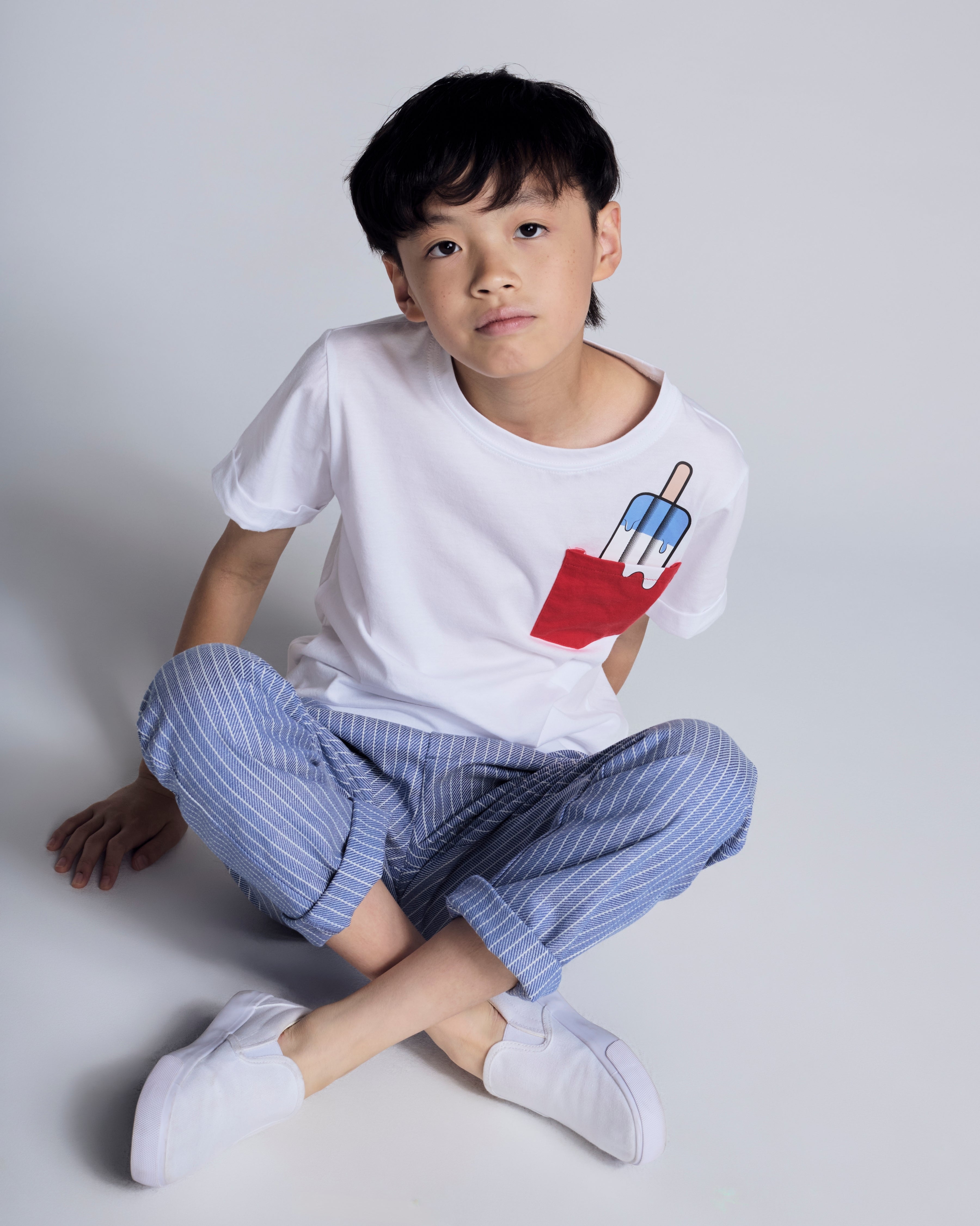Child wearing Nautical Stripe Resort Pant with white T-shirt and popsicle design.