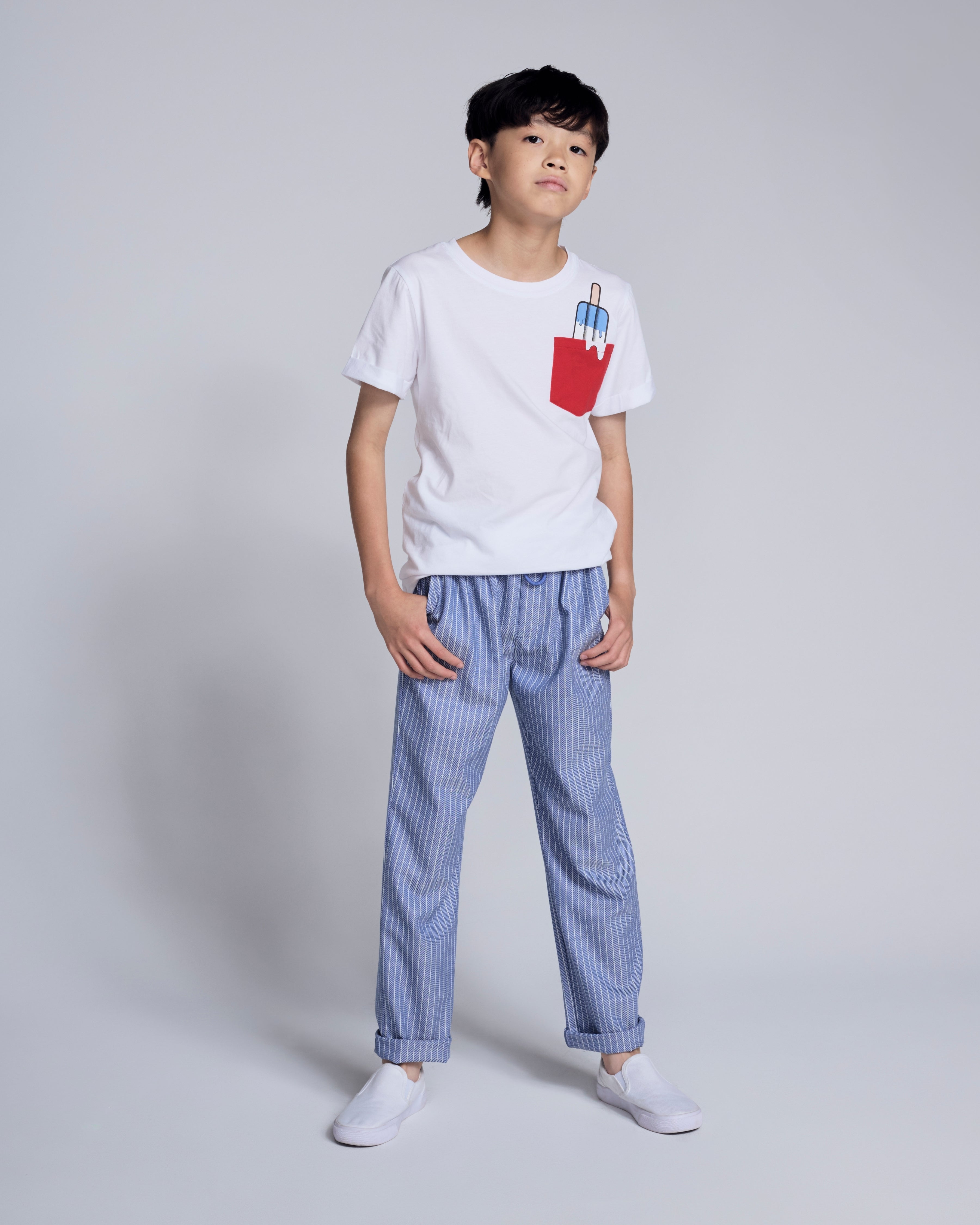 Nautical Stripe Resort Pant modeled by a young boy, featuring a casual white shirt and blue and white stripes.