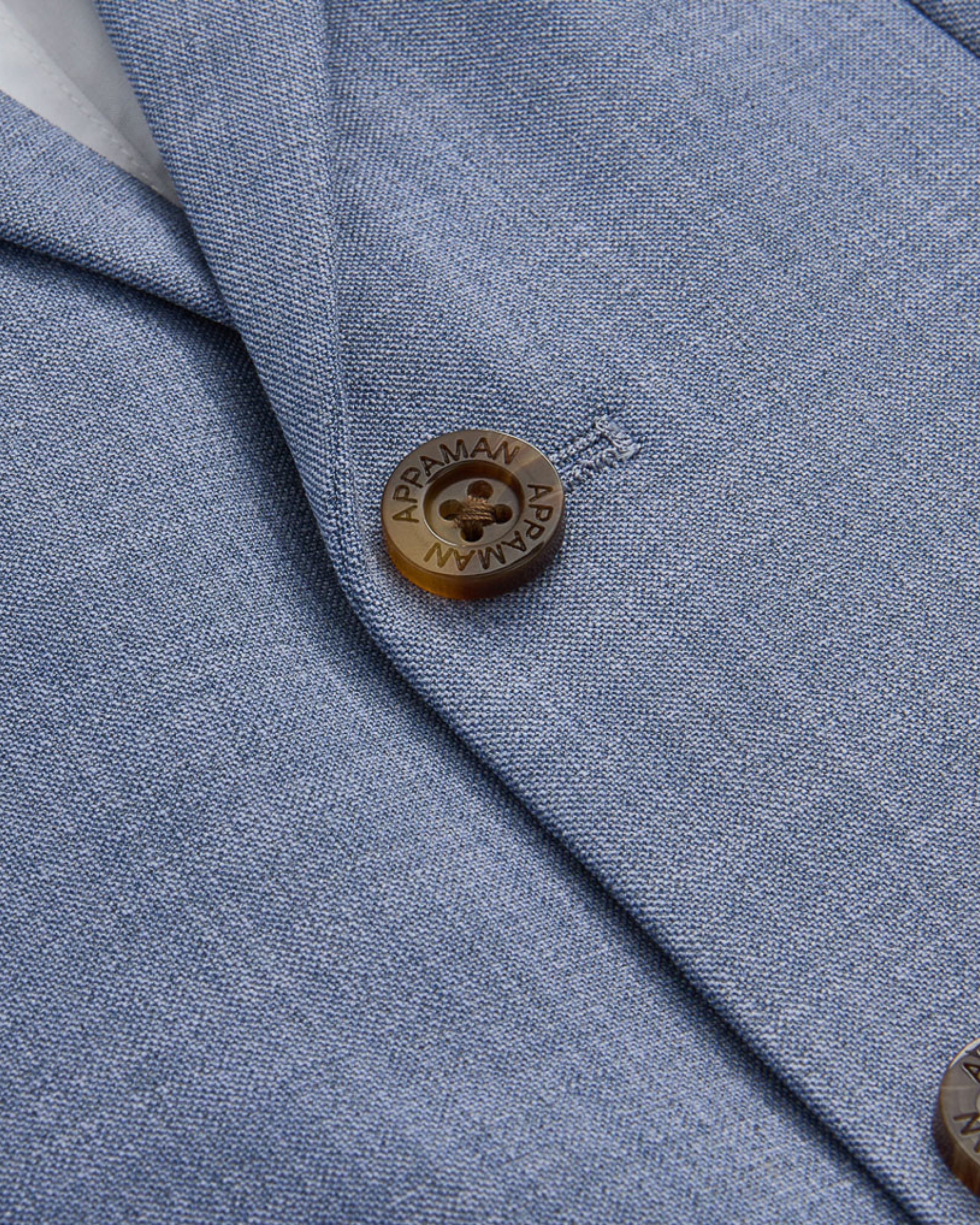 Close-up of the Pacific Blue Stretchy Mod Suit jacket with lapel collar and button detail.