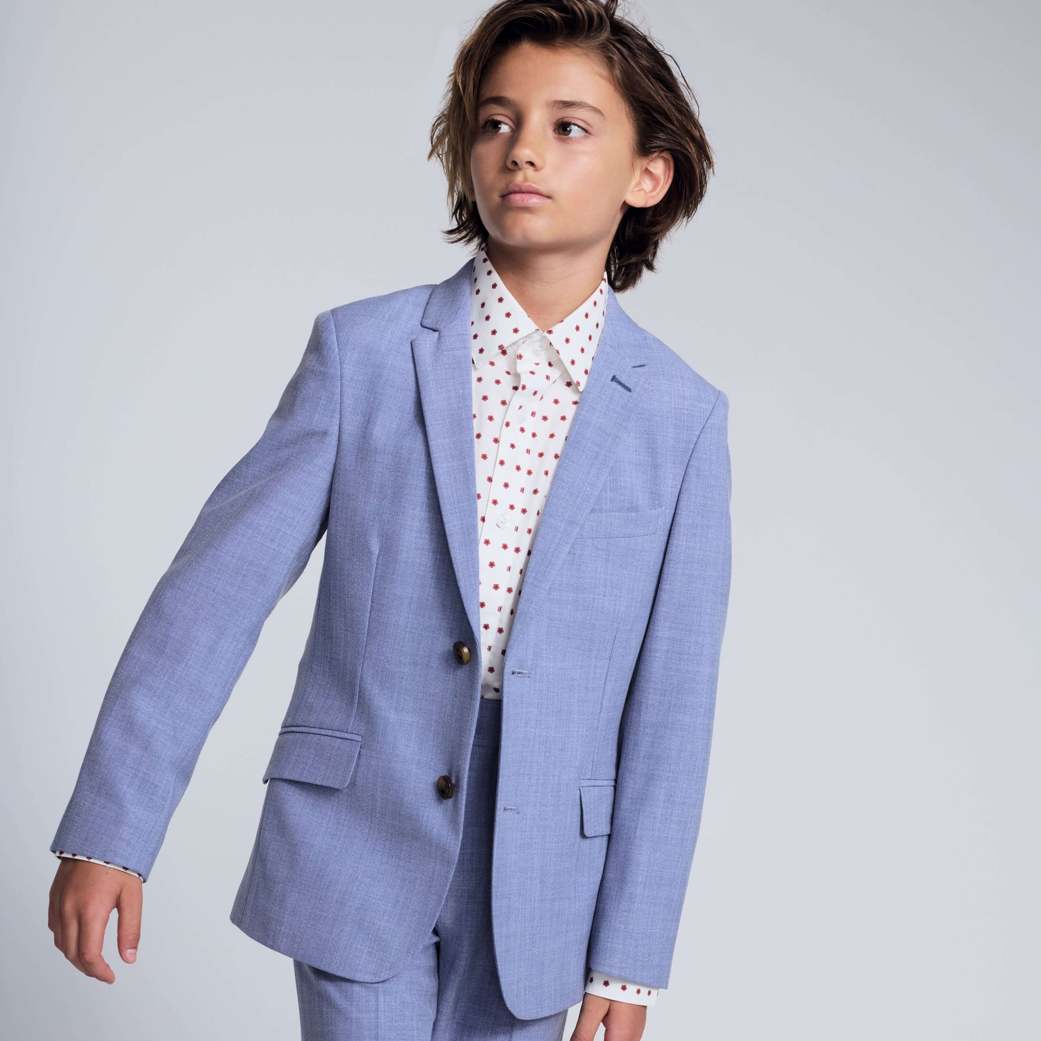 Pacific Blue Stretchy Mod Suit model wearing tailored jacket and skinny leg pants in a stylish pose.