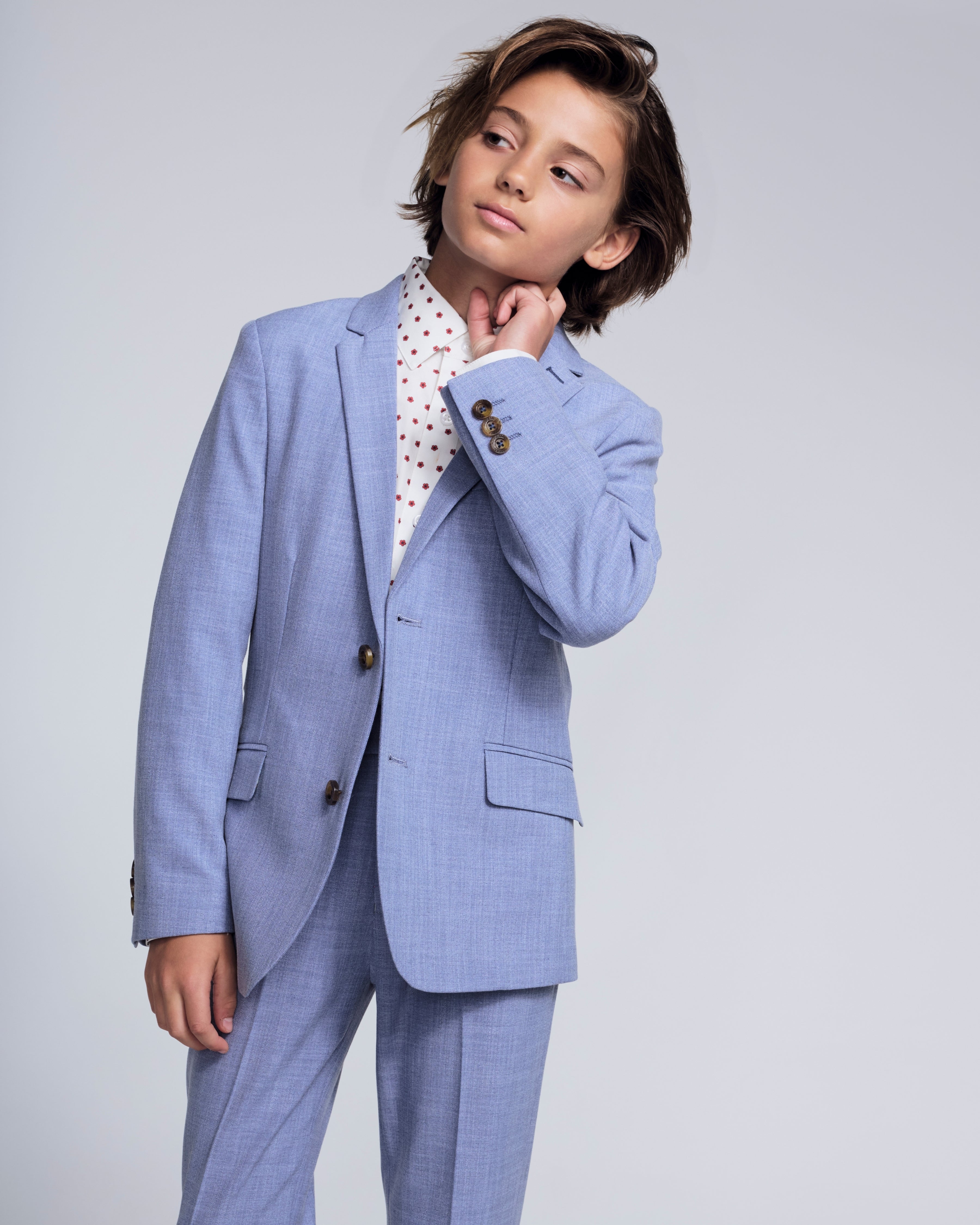 Boy in the Pacific Blue Stretchy Mod Suit, featuring a tailored jacket and stylish details.