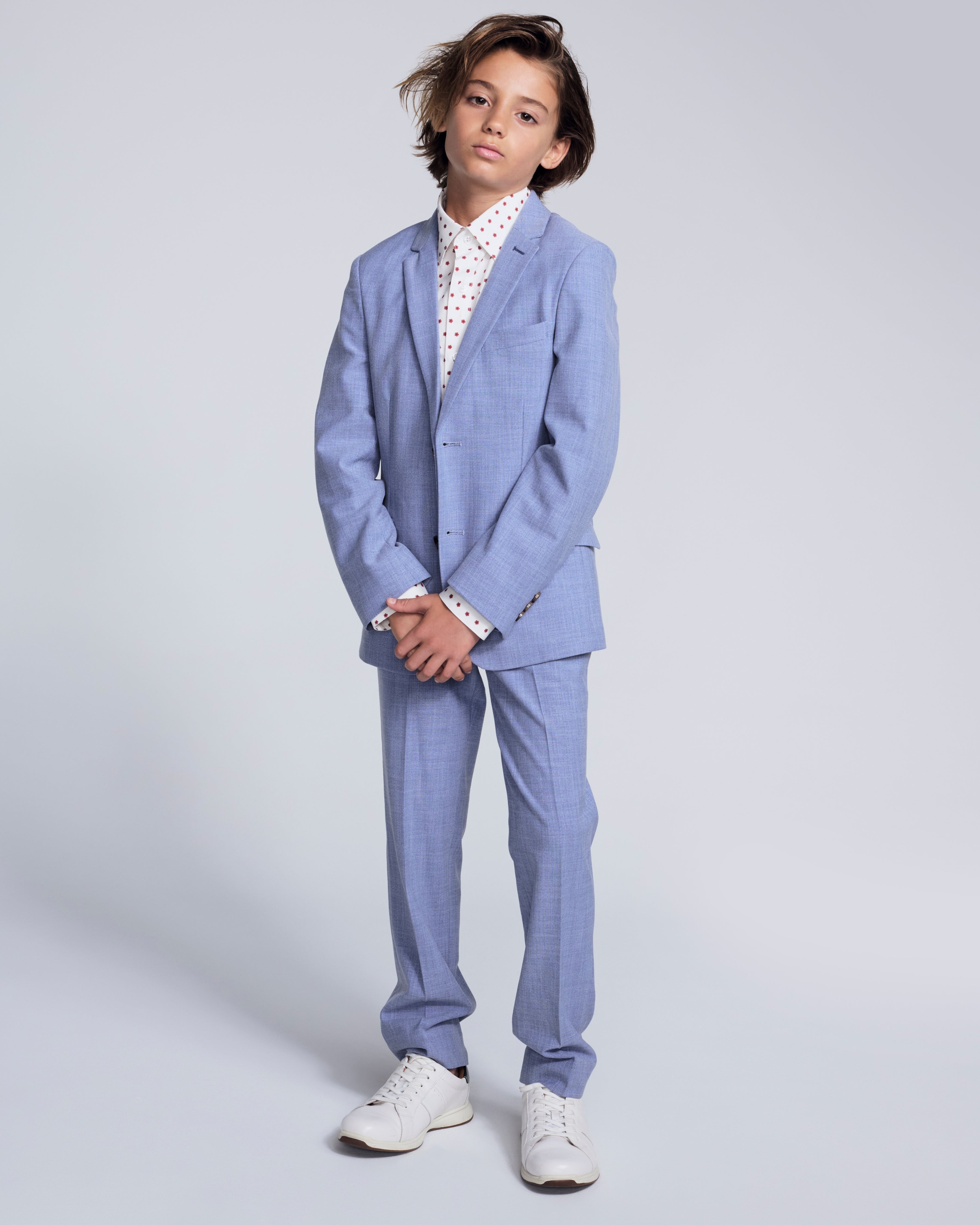 Pacific Blue Stretchy Mod Suit Pant worn by a young boy in a stylish blue suit with white sneakers.