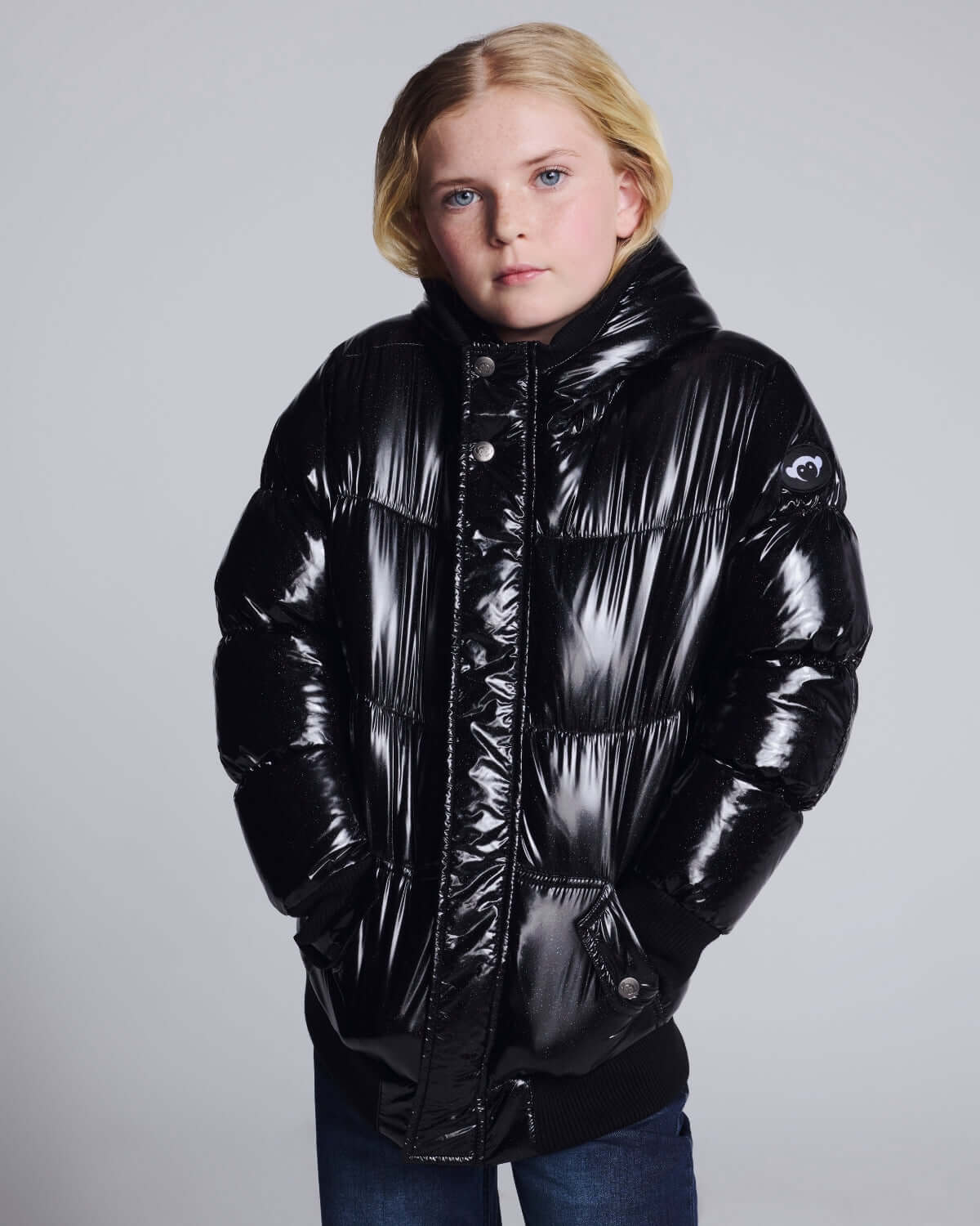 Glitter Black Slim Puffy Coat worn by girl, showcasing a shiny black finish and cozy design, perfect for chilly days.