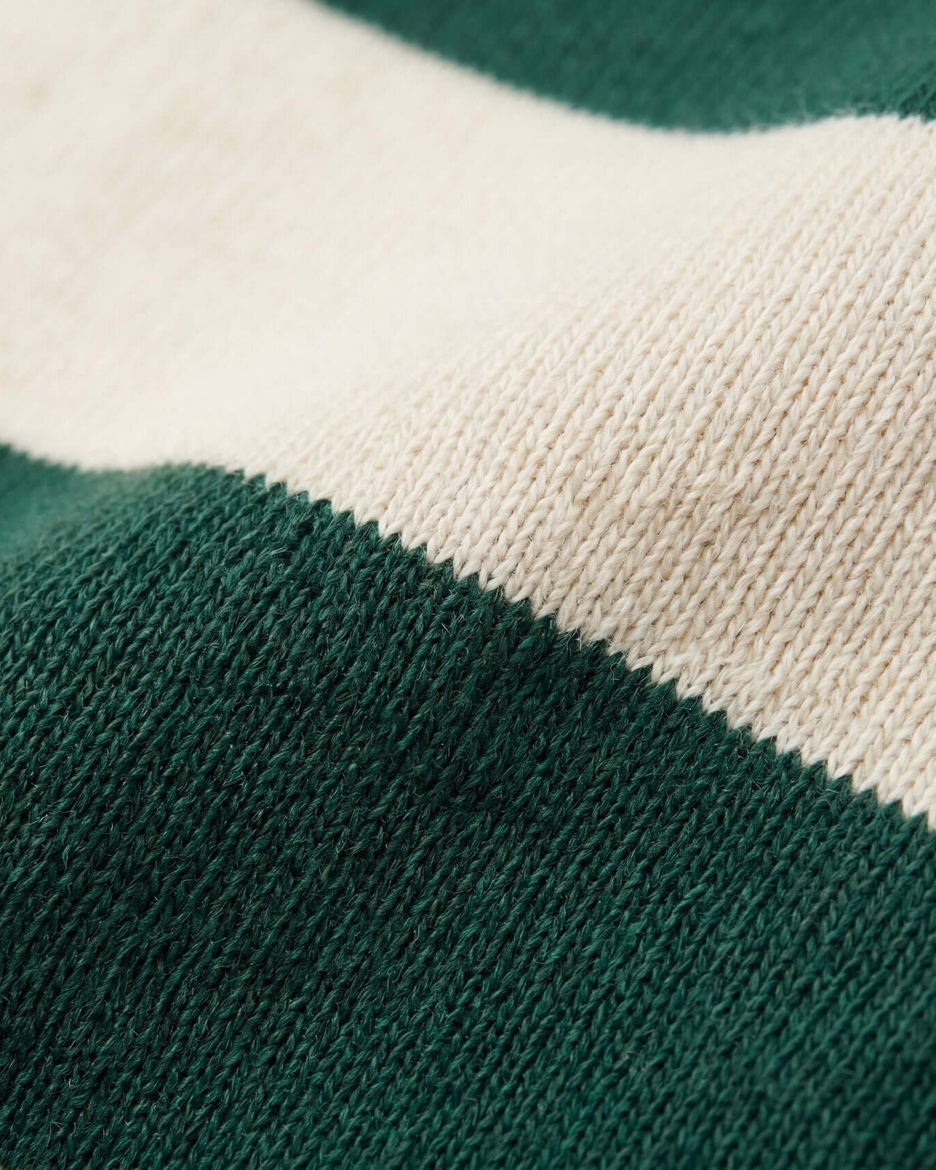 Close-up of green and beige fabric with a textured pattern