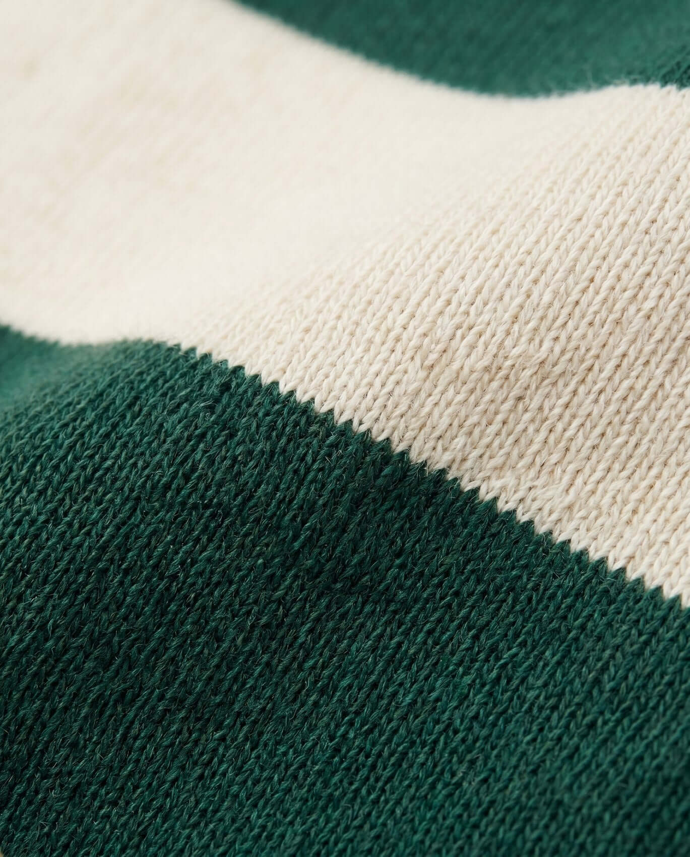 Close-up of green and beige fabric with a textured pattern