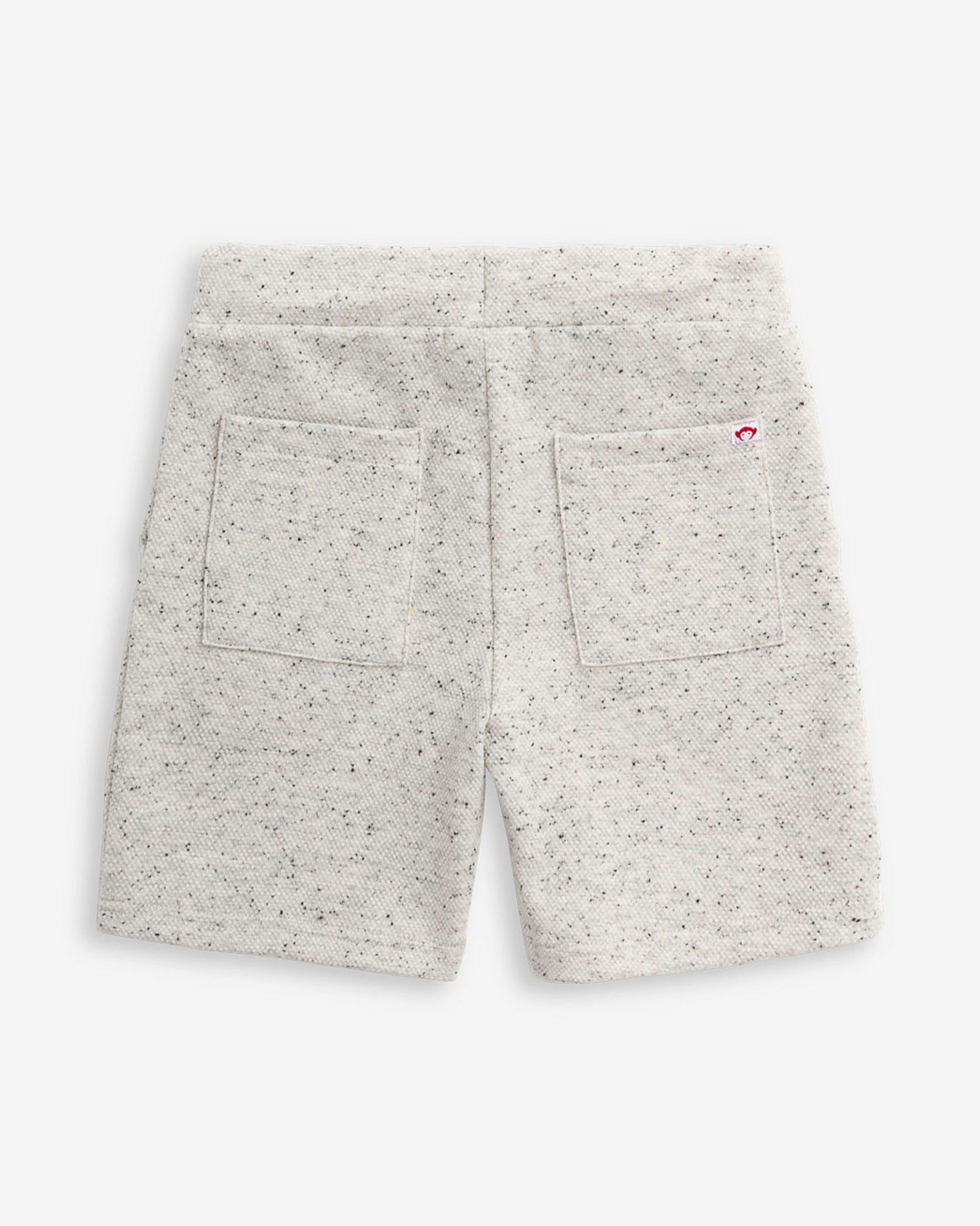 Back view of Speckled Natural Resort Short with two pockets, designed for comfort and style during summer days.
