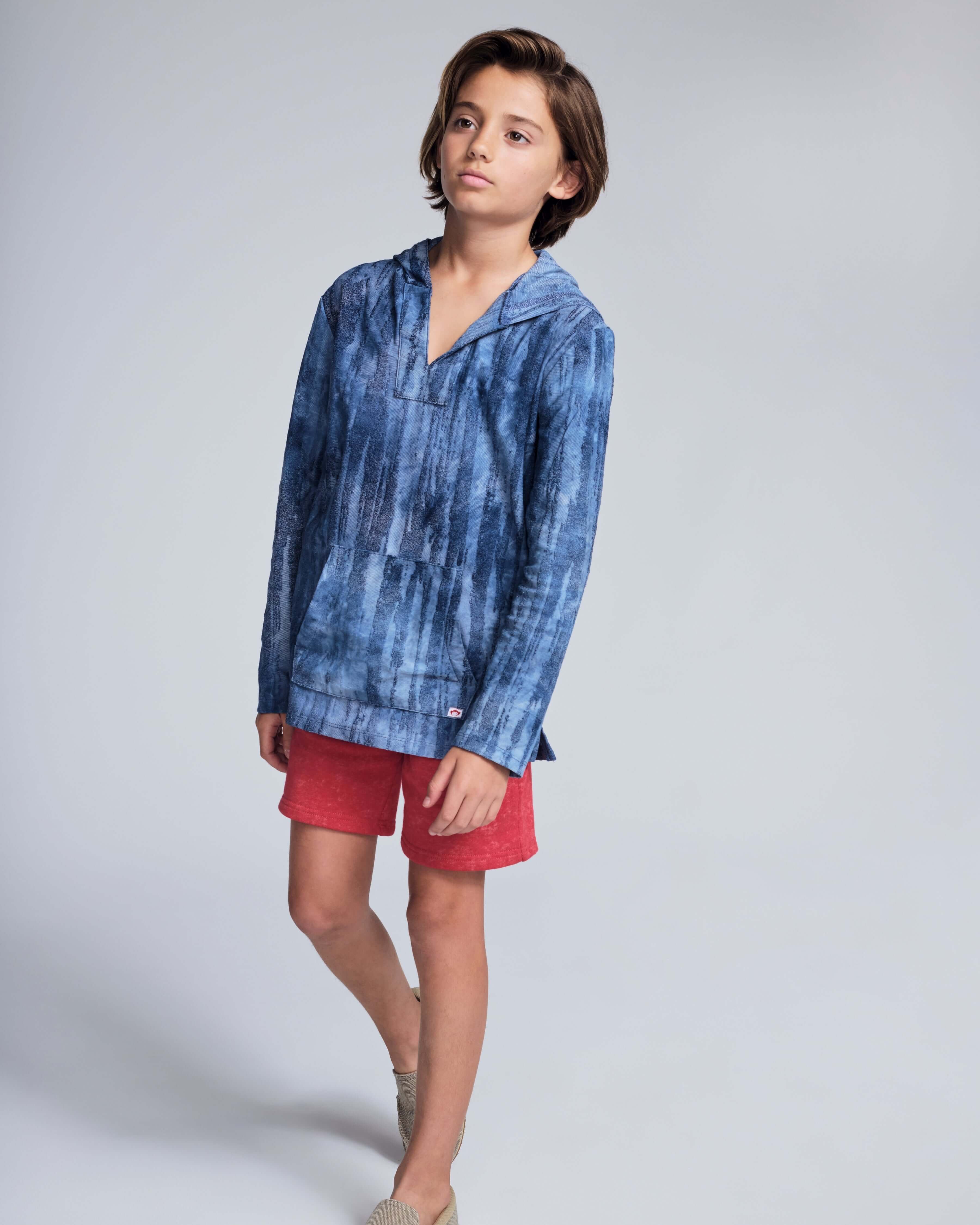 Child wearing a blue hoodie and Washed Red Preston Short, perfect for summer days and casual wear.