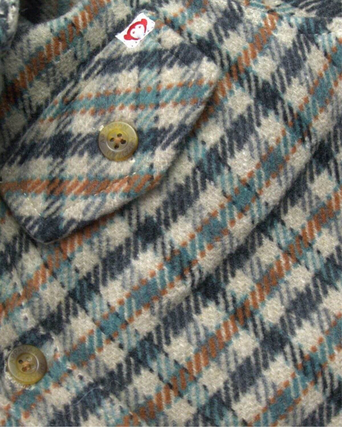 Beige Check Glen Flannel Hoodie close-up showing buttons and check pattern.