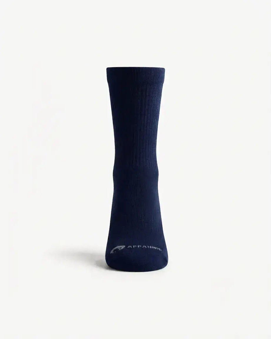 A single navy blue crew sock with a small white 'APPAMAN' logo near the toe, displayed on a clean white background.