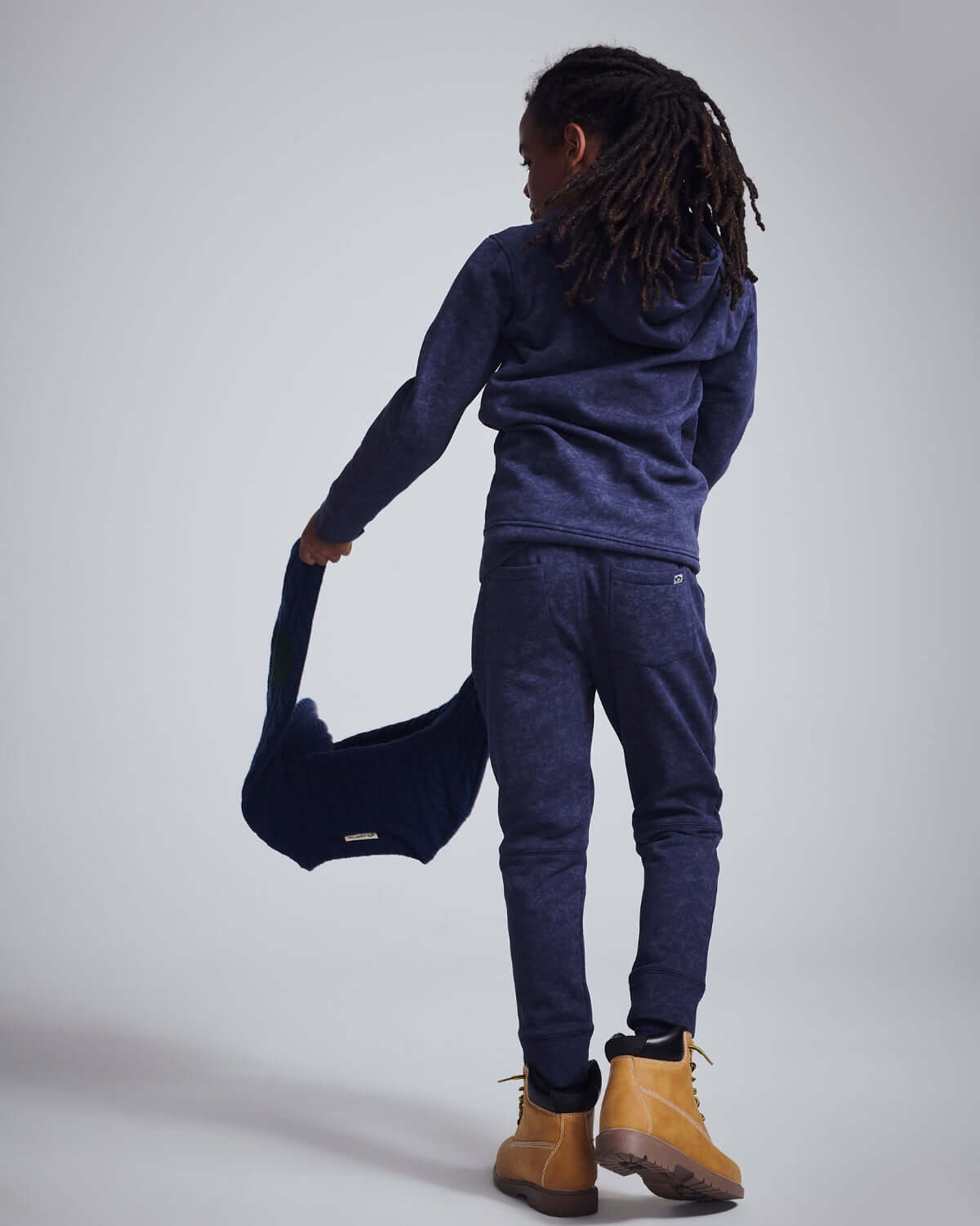 Child wearing Washed Navy Bolt Sidewalk Sweatpants, showcasing comfort and style, perfect for all-day play.
