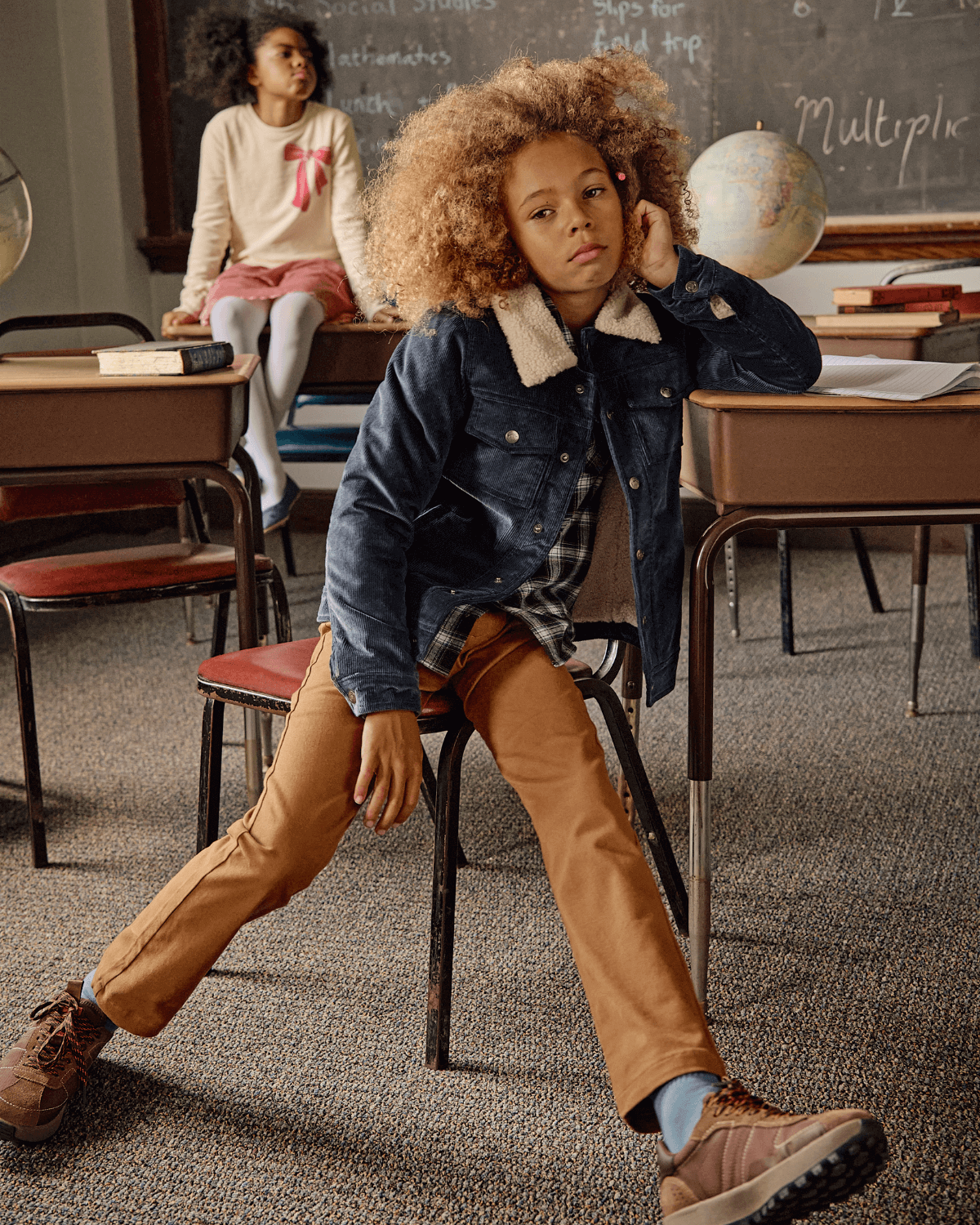 British Khaki Commuter Twill Pants worn by a child sitting in a classroom, paired with a stylish jacket.