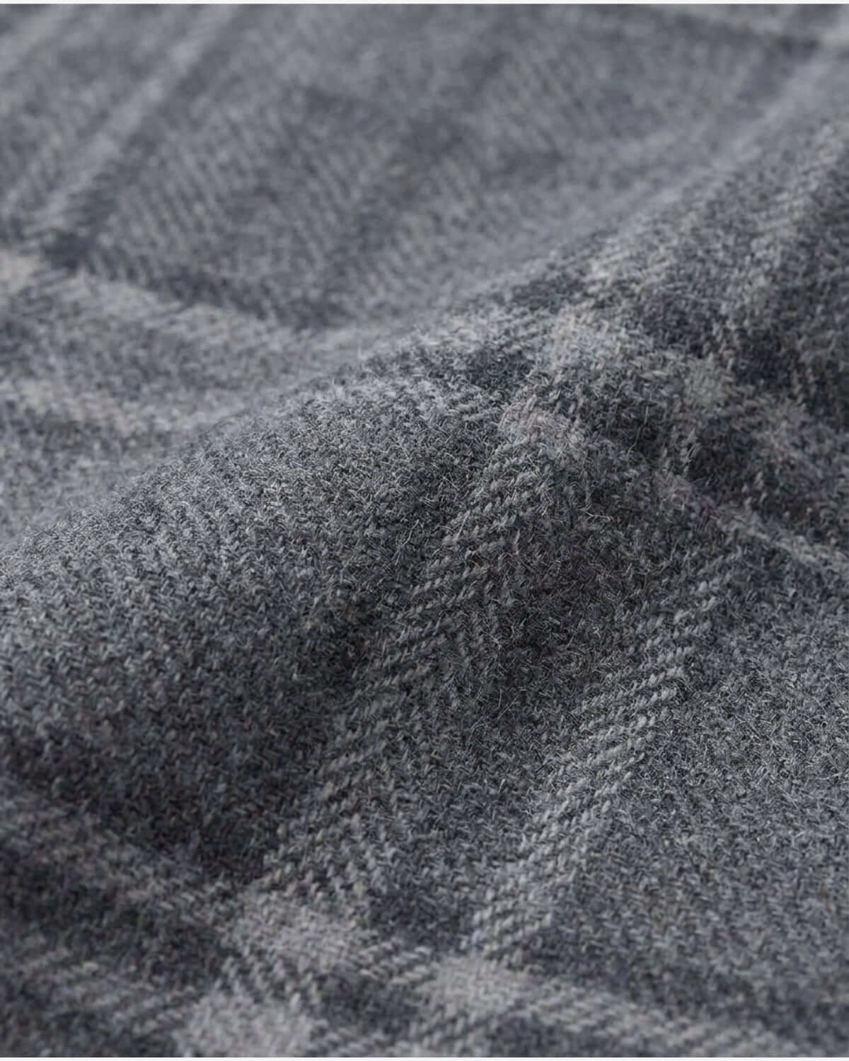 Close-up of gray fabric with a subtle pattern