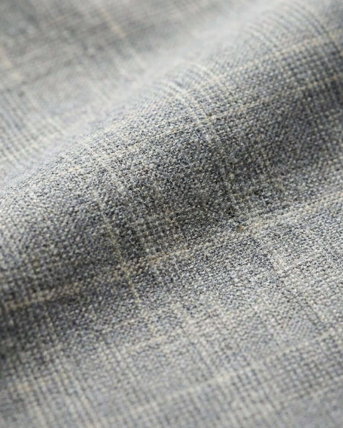 Close-up of textured gray fabric with a subtle pattern