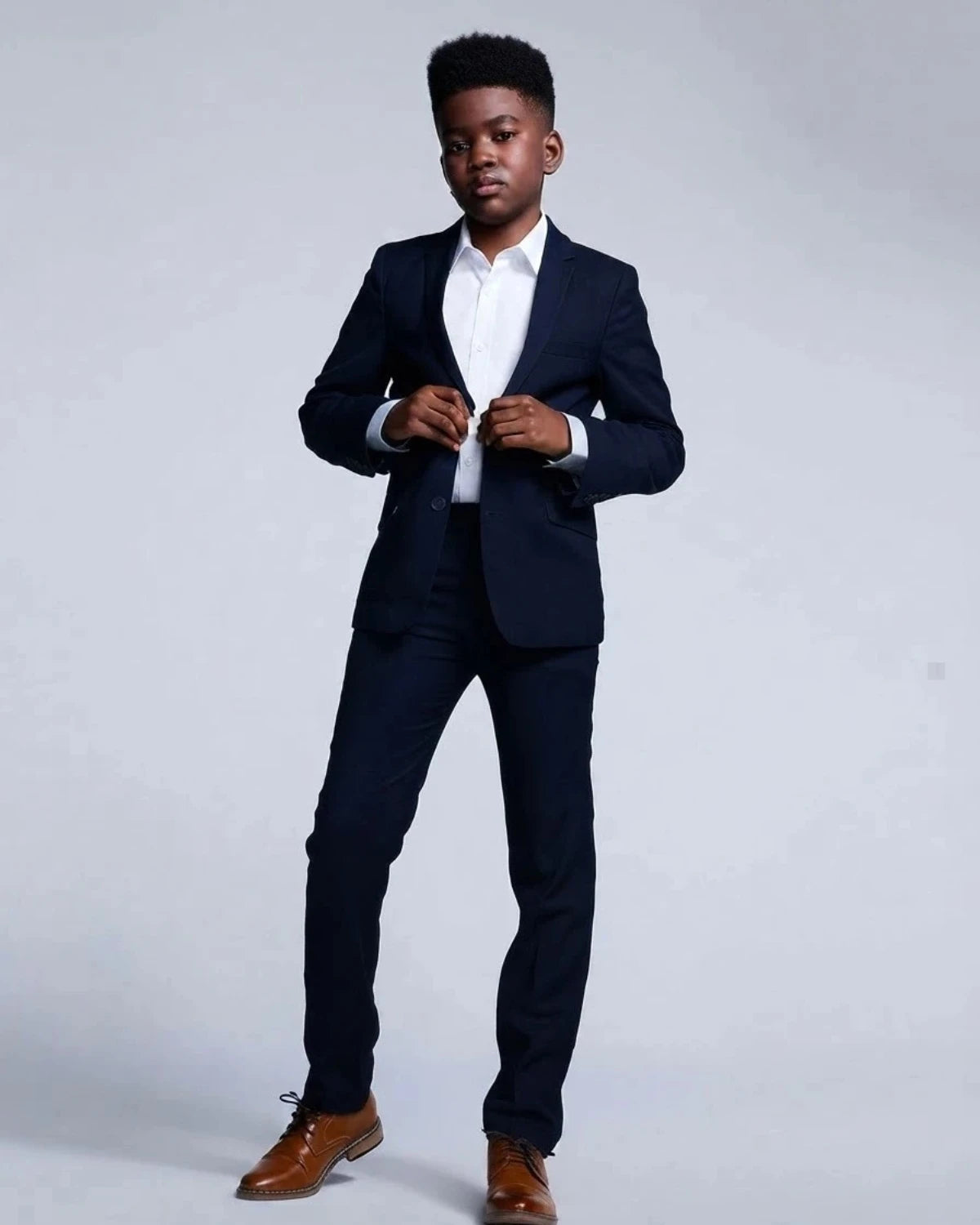 Appaman boys' navy two piece suit, shown on a model.