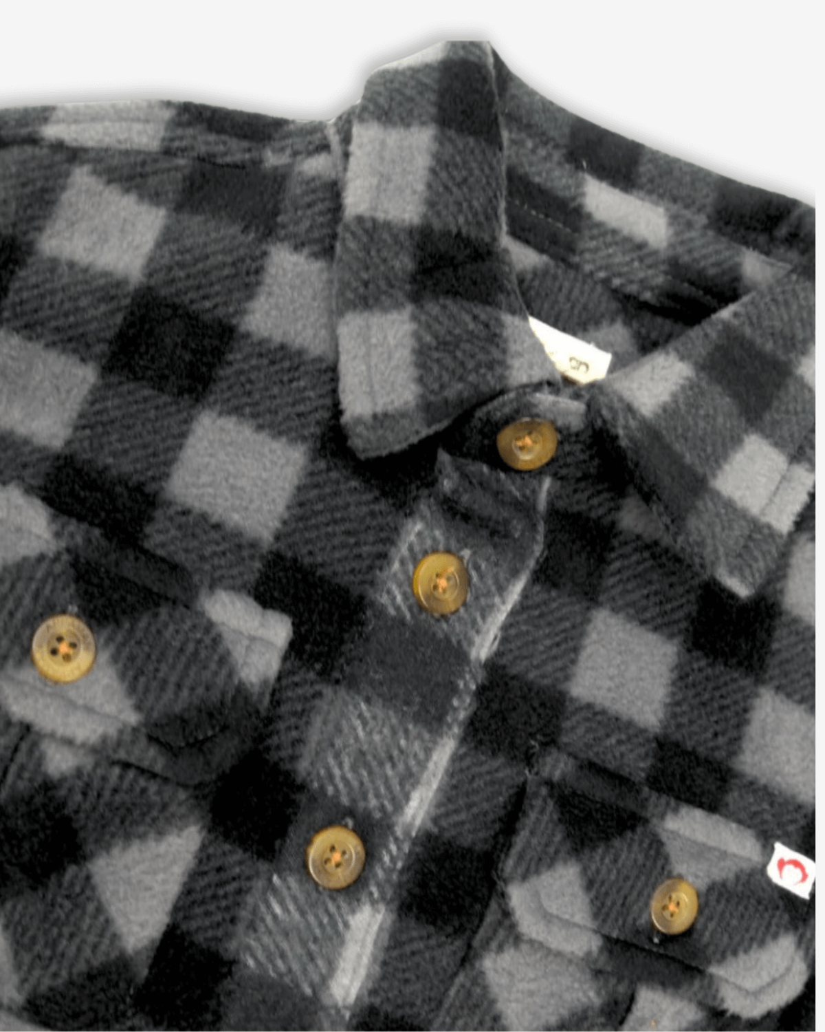 Grey/Black Check Snow Fleece Shirt close-up showing buttons and fleece texture.
