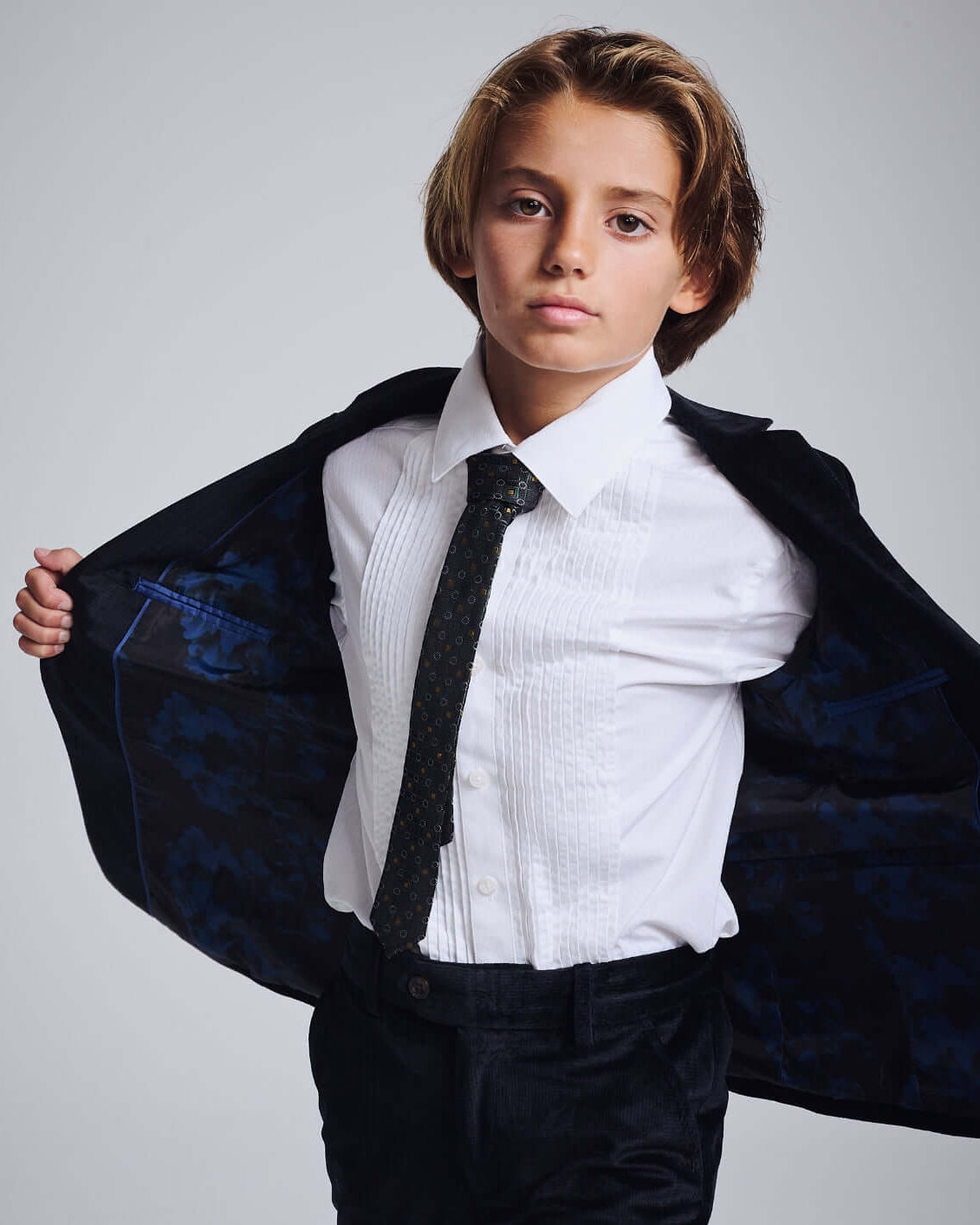 Boy in a classic White Tuxedo Shirt with a blazer, ready for formal events.