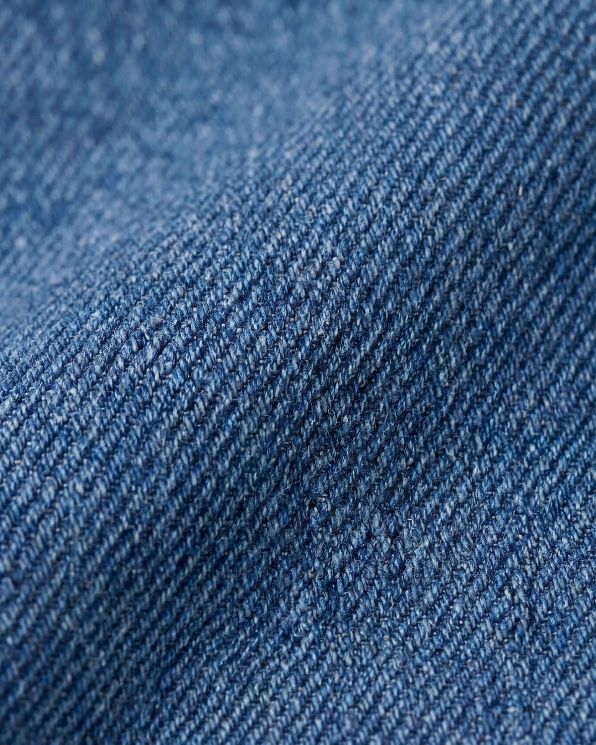 Close-up of Cambridge Wash Christa Denim Cargo fabric showing texture and color for kids' active wear.