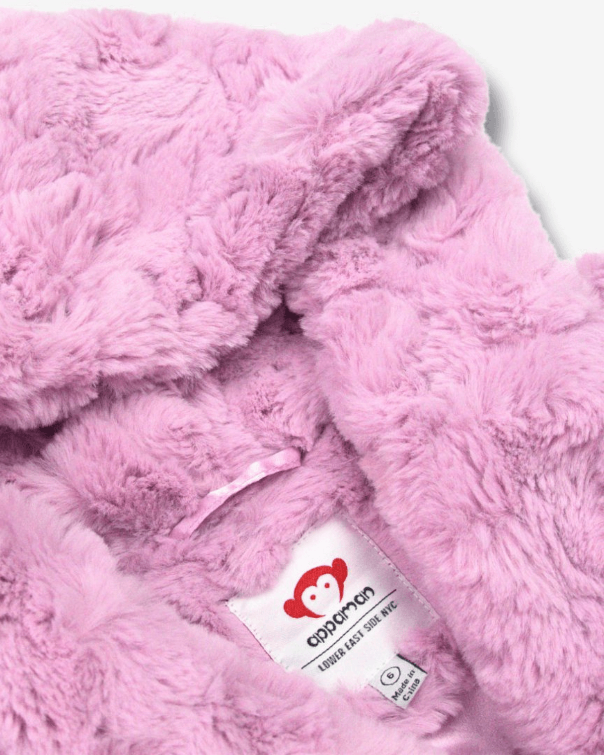 Pink Mousse Cleo Faux Fur Coat interior showcasing its luxurious softness and vibrant pink color.