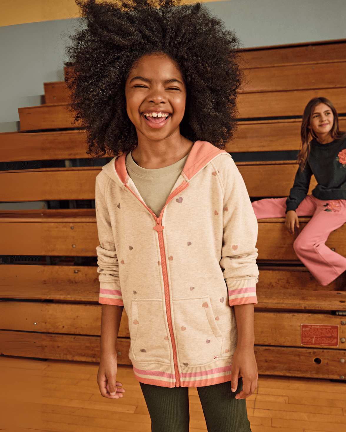 Heart Pink Sweat Set featuring a joyful girl wearing a soft hoodie, perfect for comfortable layering and playful wear.