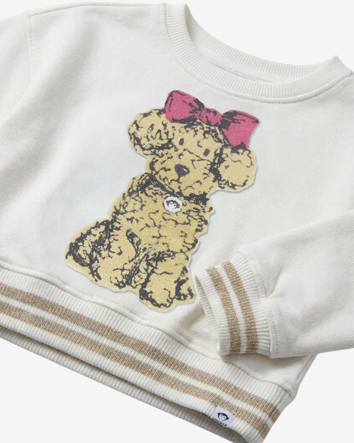 White sweatshirt with a teddy bear design and pink bow on a white background