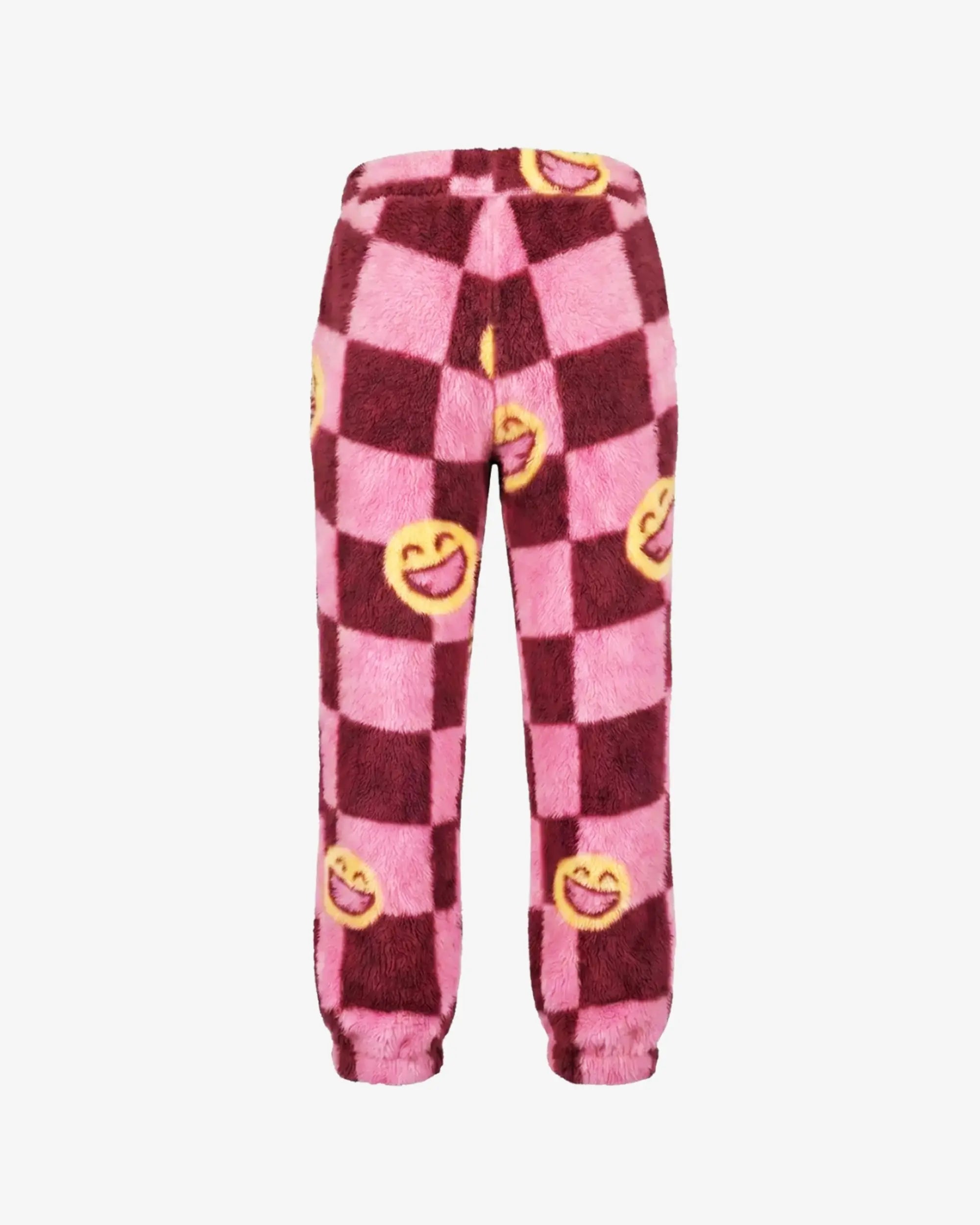 Pink and dark red checkered fleece pants with yellow smiley face prints, shown against a plain white background.