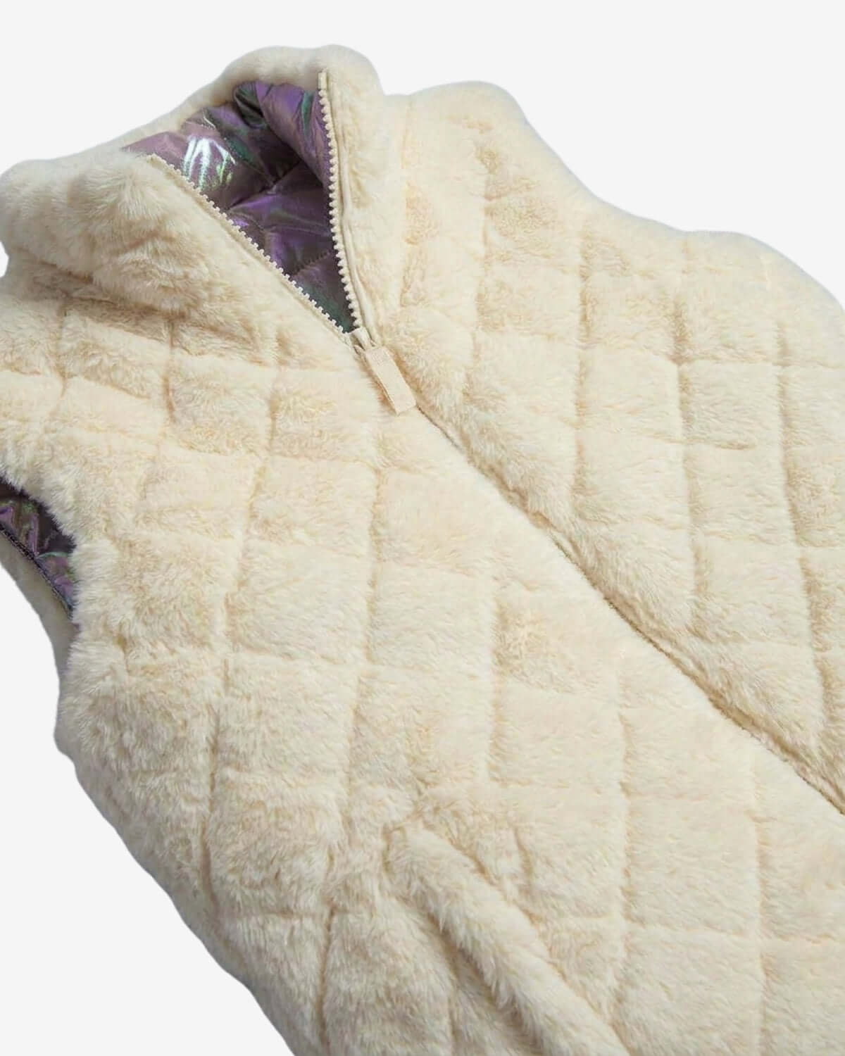 Close-up of a beige quilted vest with a zipper on a white background
