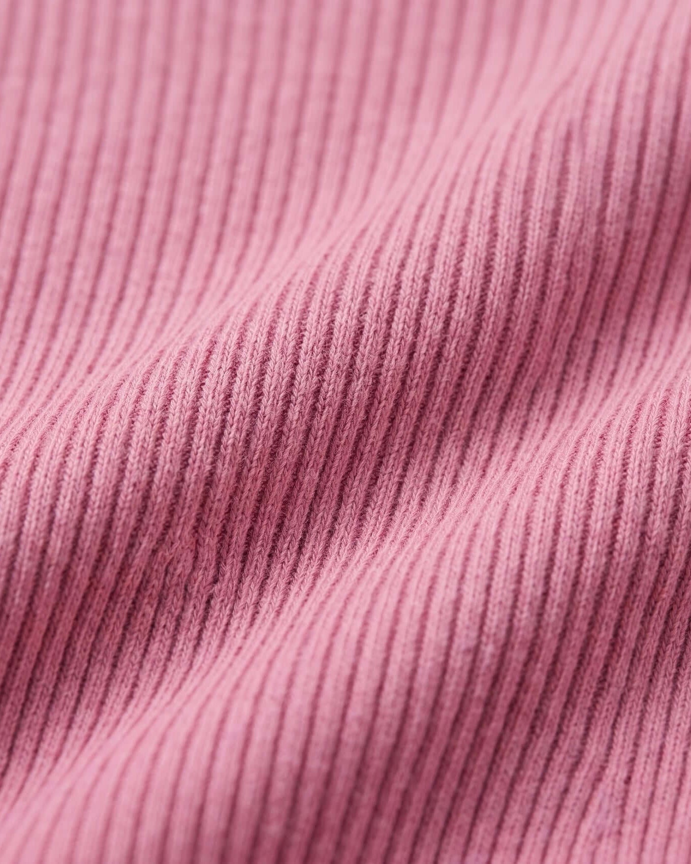 Close-up of pink ribbed fabric texture