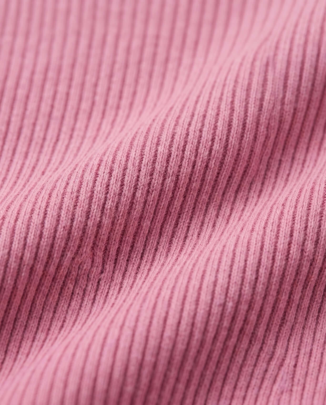 Close-up of pink ribbed fabric texture