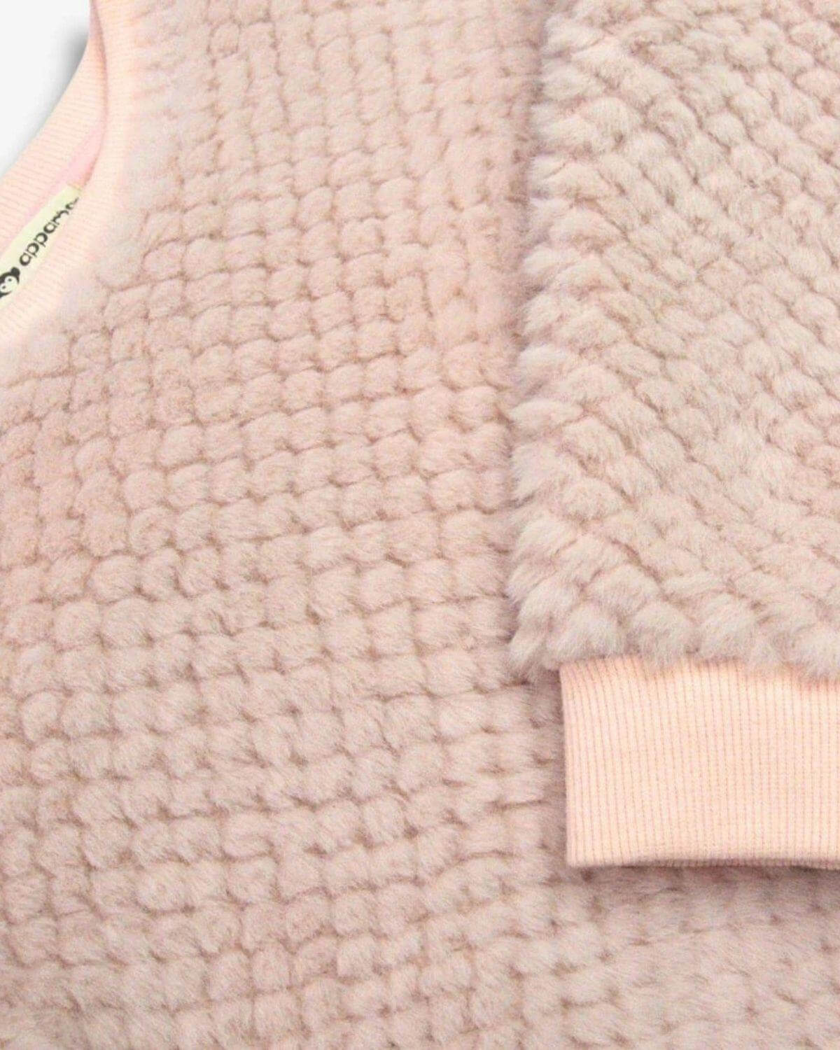 Vintage Pink Laurel Top featuring cozy faux fur and diamond quilted pattern for warmth.