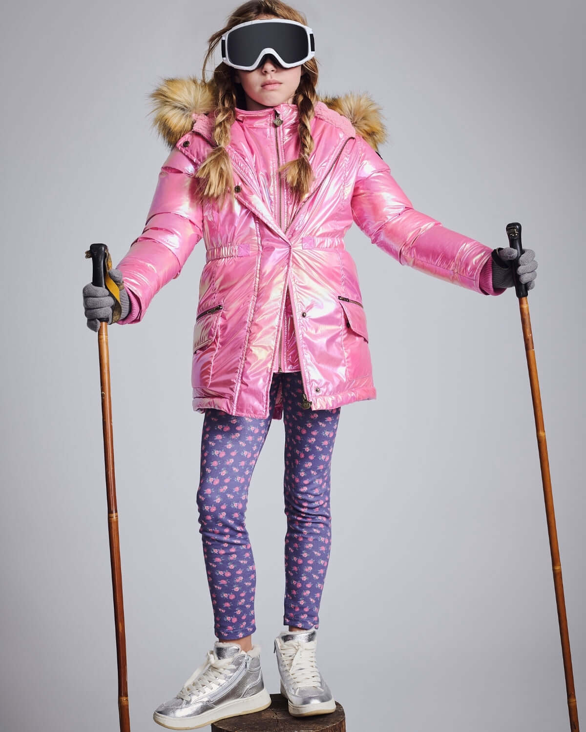 Navy Primrose Leggings worn under a pink ski jacket, perfect for kids' stylish and cozy winter wear.