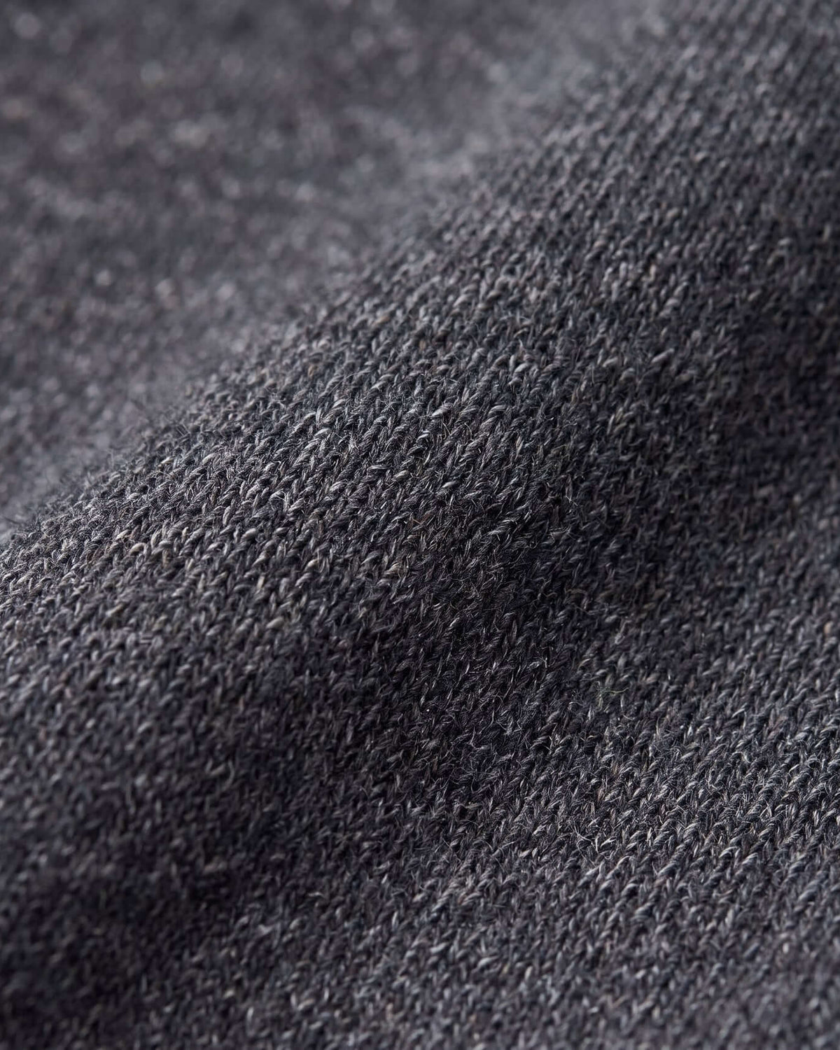 Close-up of Black Glitter Lily Seamed Sweatpants fabric showcasing soft texture and glitter finish, perfect for active kids.