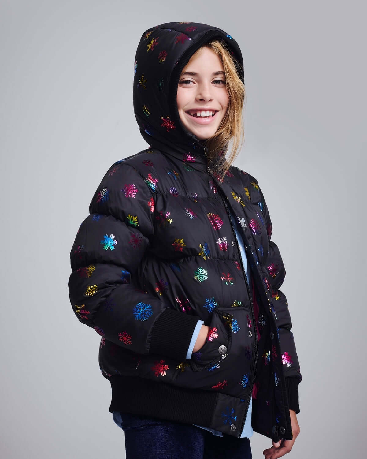 Rainbow Snowflakes Slim Puffy Coat on a girl, showcasing vibrant colors and cozy warmth, perfect for winter.